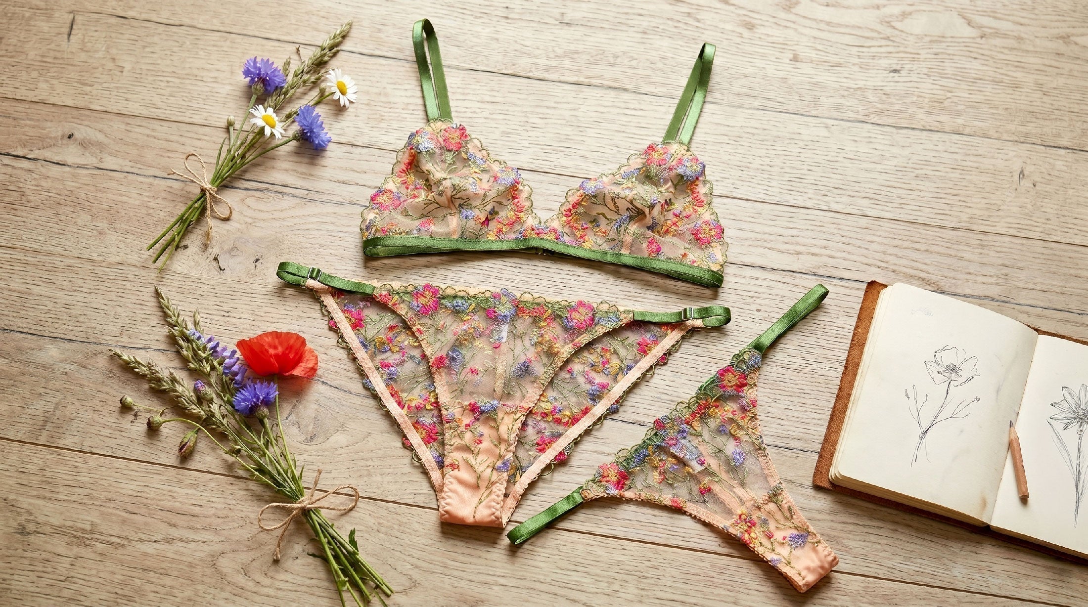 Floral lingerie set with sketches and bunches of wildflowers