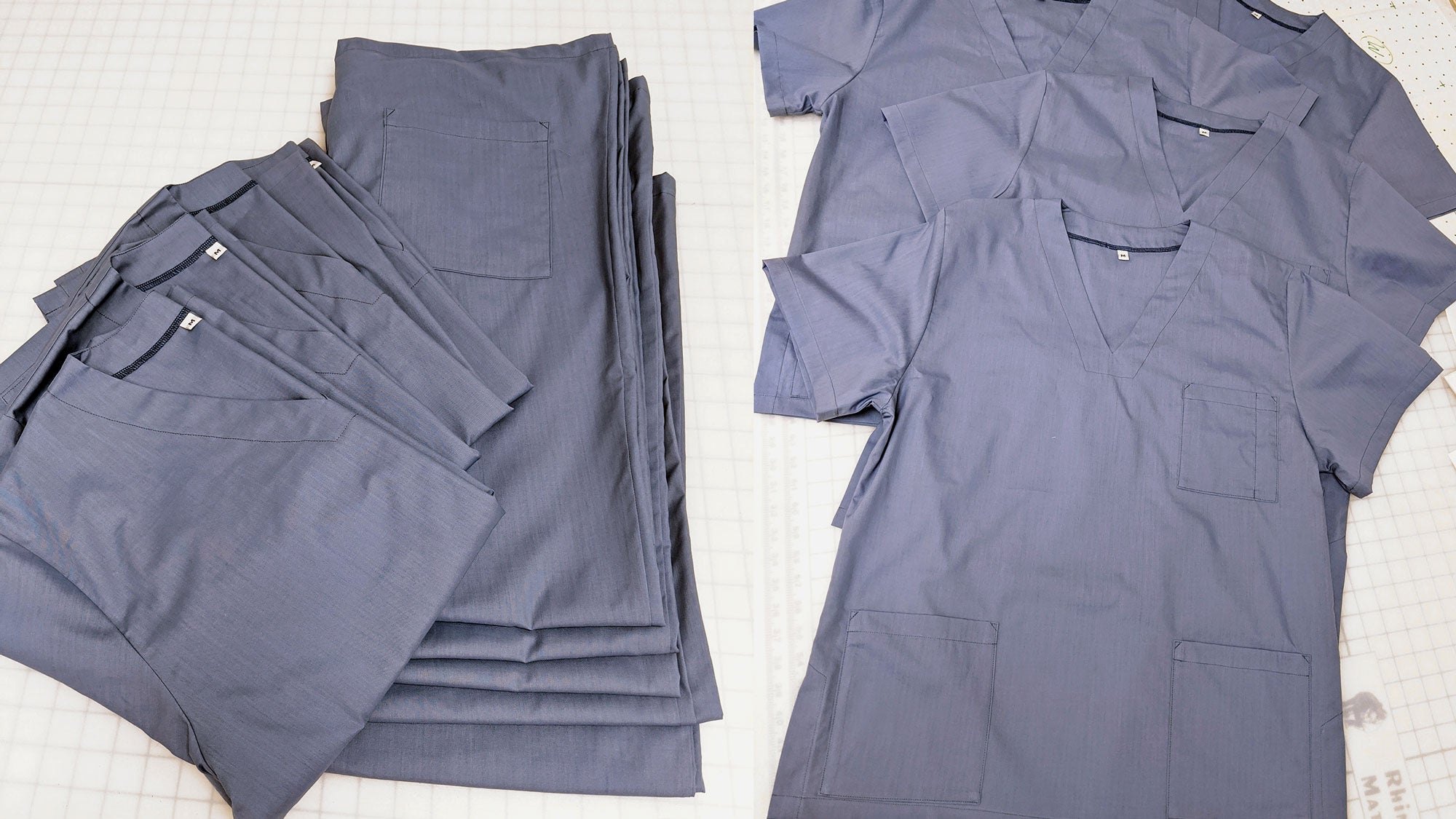 Volunteer sewing scrubs for donation to the NHS in England