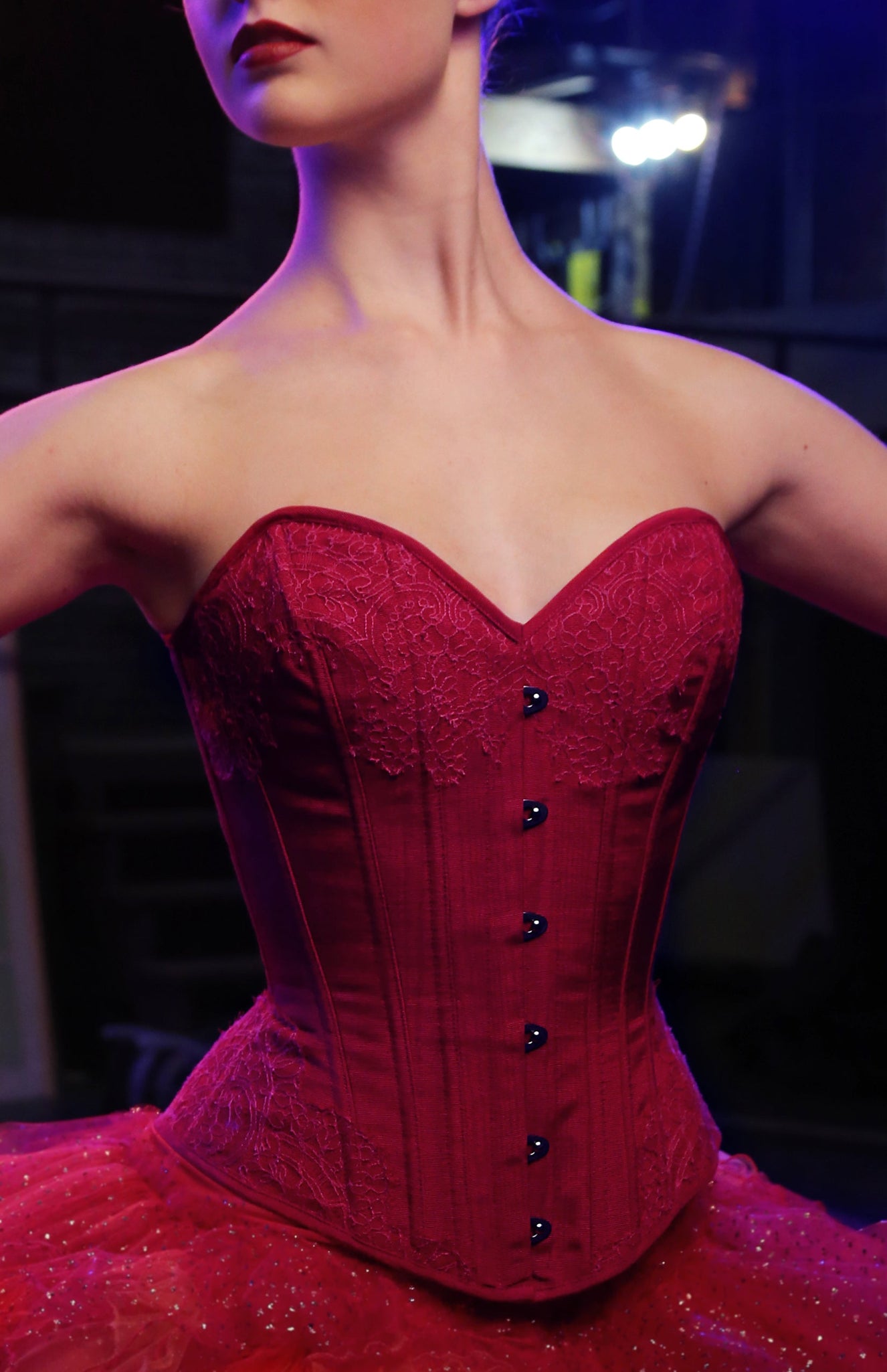 Red victorian corset with sweetheart neckline and french lace overlays and tutu skirt