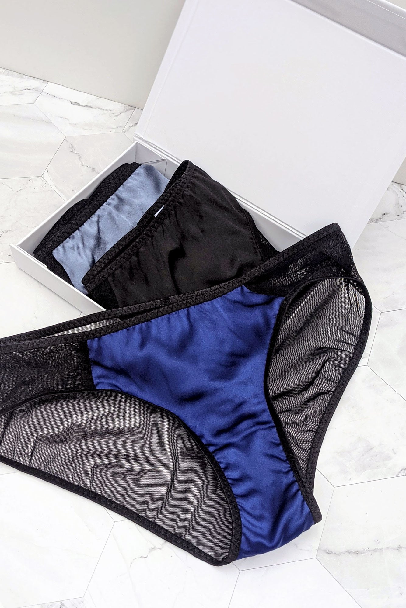3 pairs of silk panties in blue and black satin and mesh