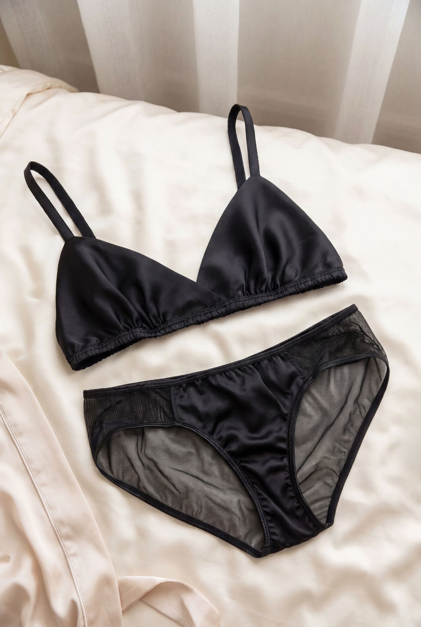 Black satin bra and silk and mesh panties set by luxury lingerie designer Angela Friedman