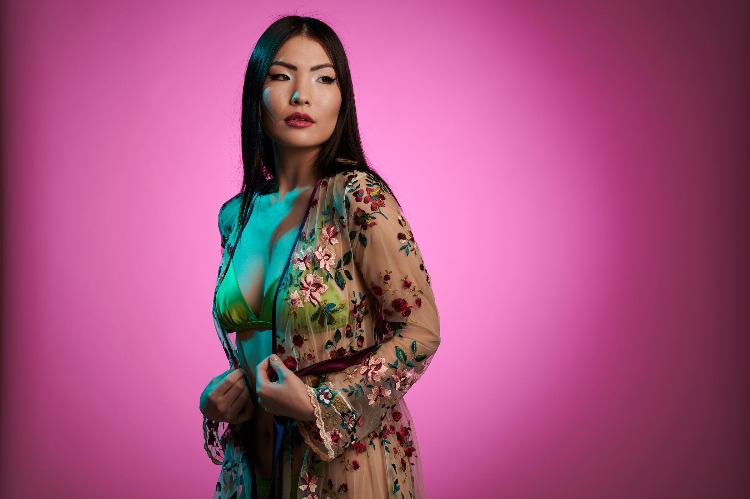 Sheer embroidered robe with multicolor flowers, worn over a lime green silk bra