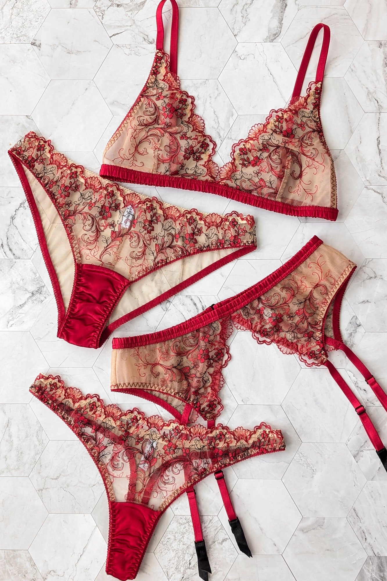 Scalloped lace lingerie set in red silk with nude sheer mesh and floral embroidery motifs