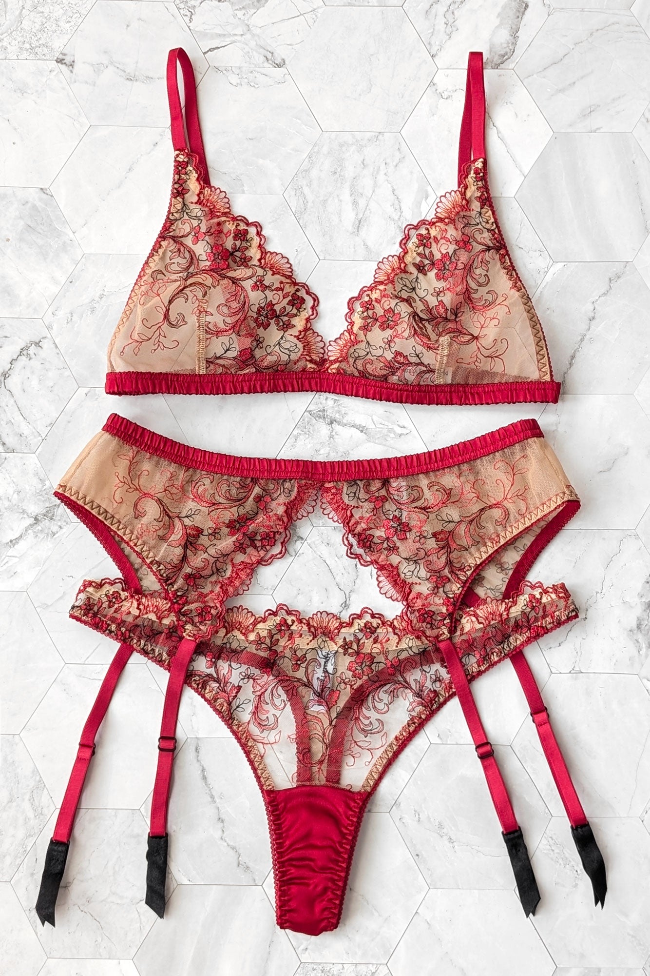 Red and beige lace lingerie set with silk trims and a retro style garter belt