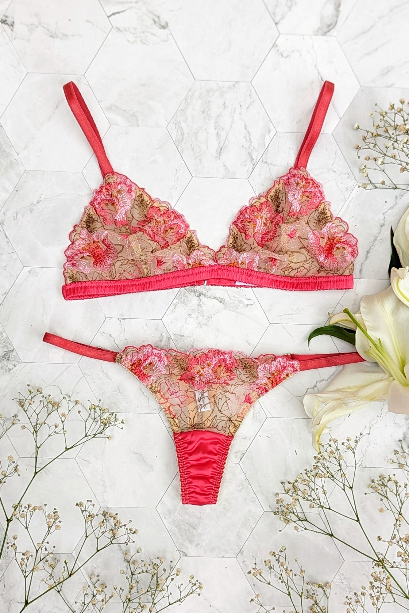 Designer lingerie set in coral pink with flower embroidered mesh and silk satin trim
