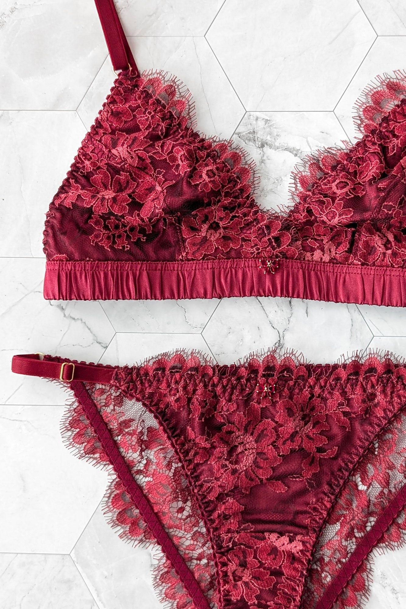 Luxury lingerie set including a silk bralette and French lace underwear with red bows