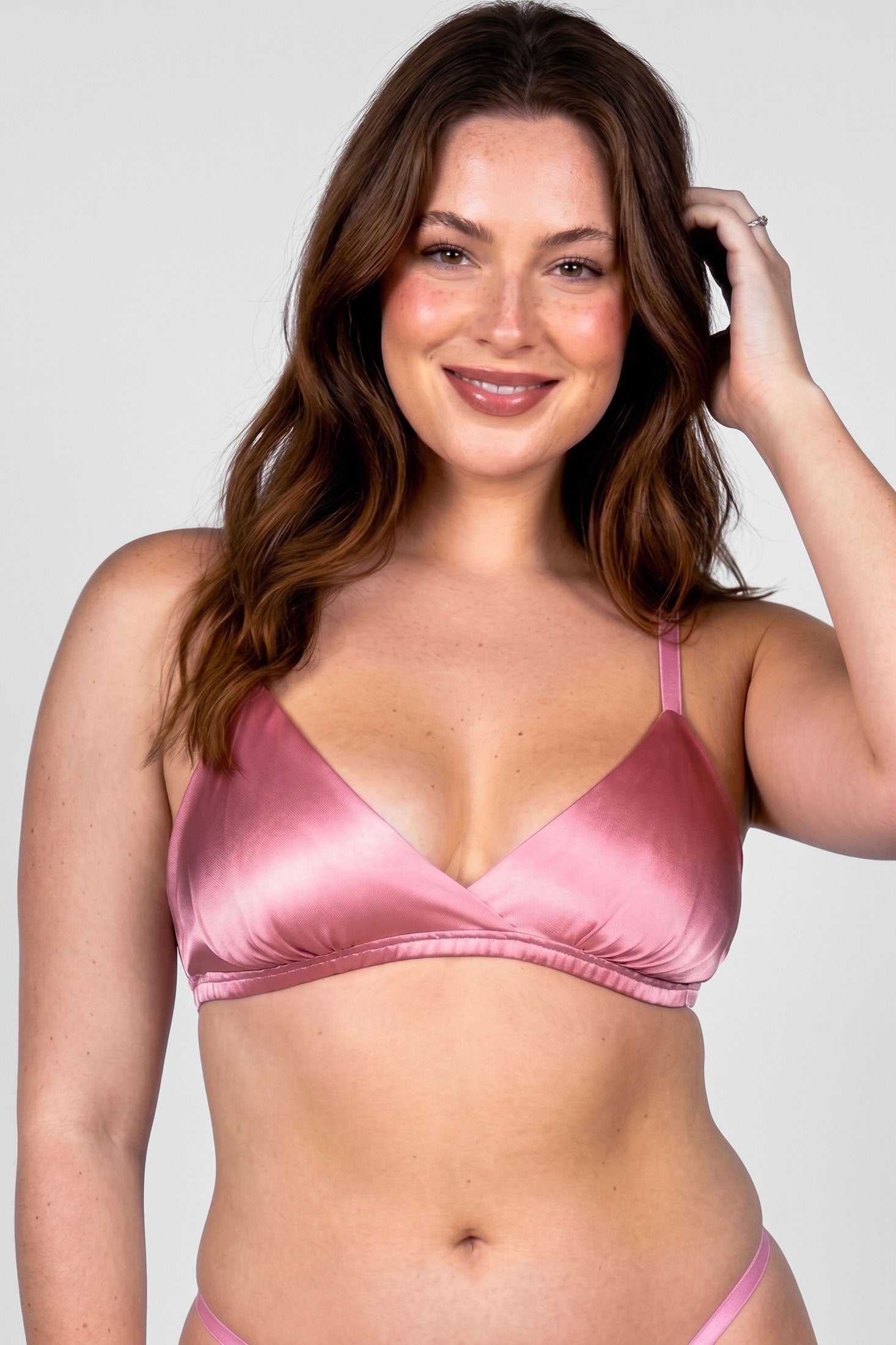 Luxury designer bra in pink silk satin with a ruched elastic band and matching silk underwear