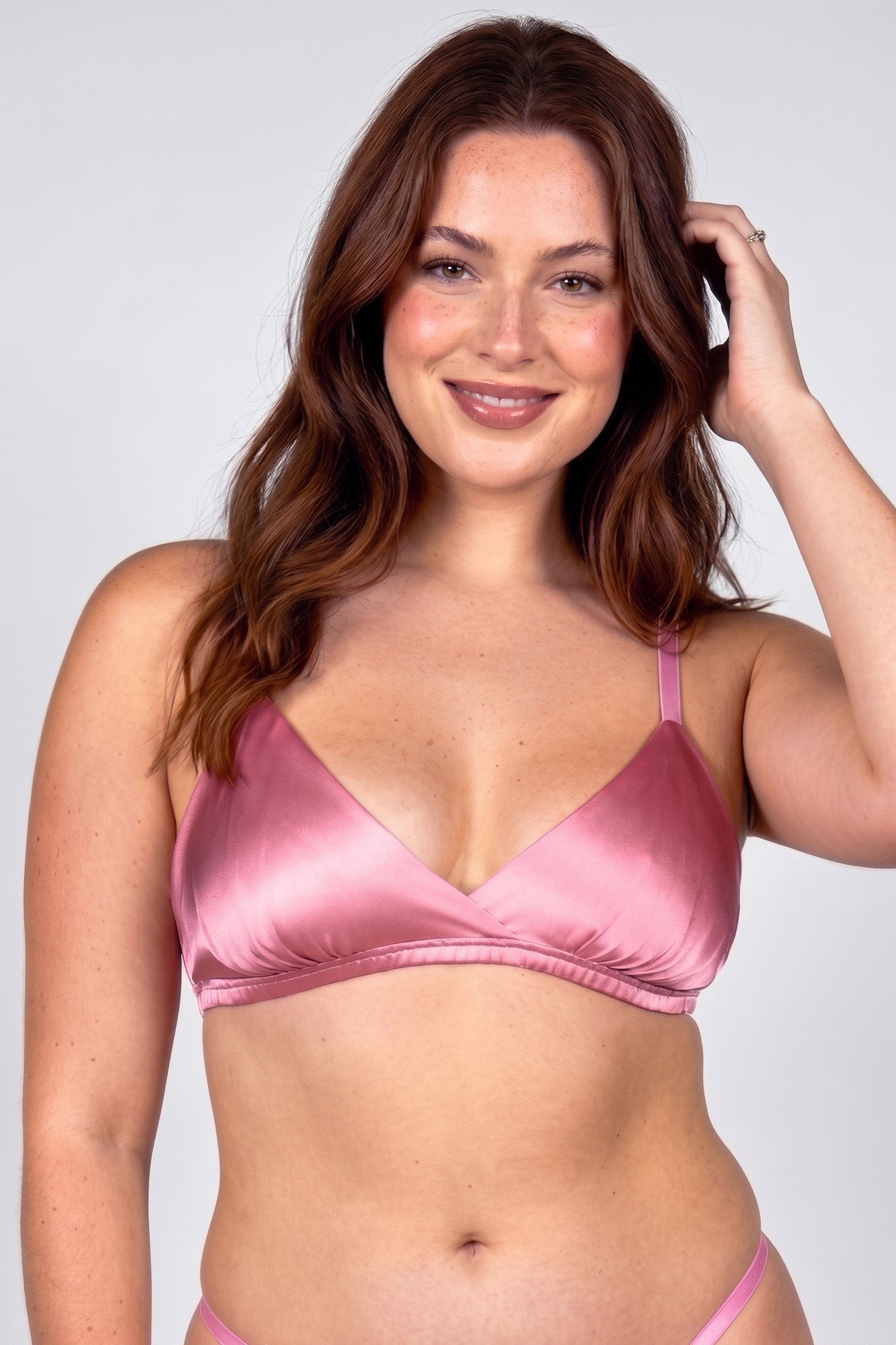Luxury designer bra in pink silk satin with a ruched elastic band and matching silk underwear