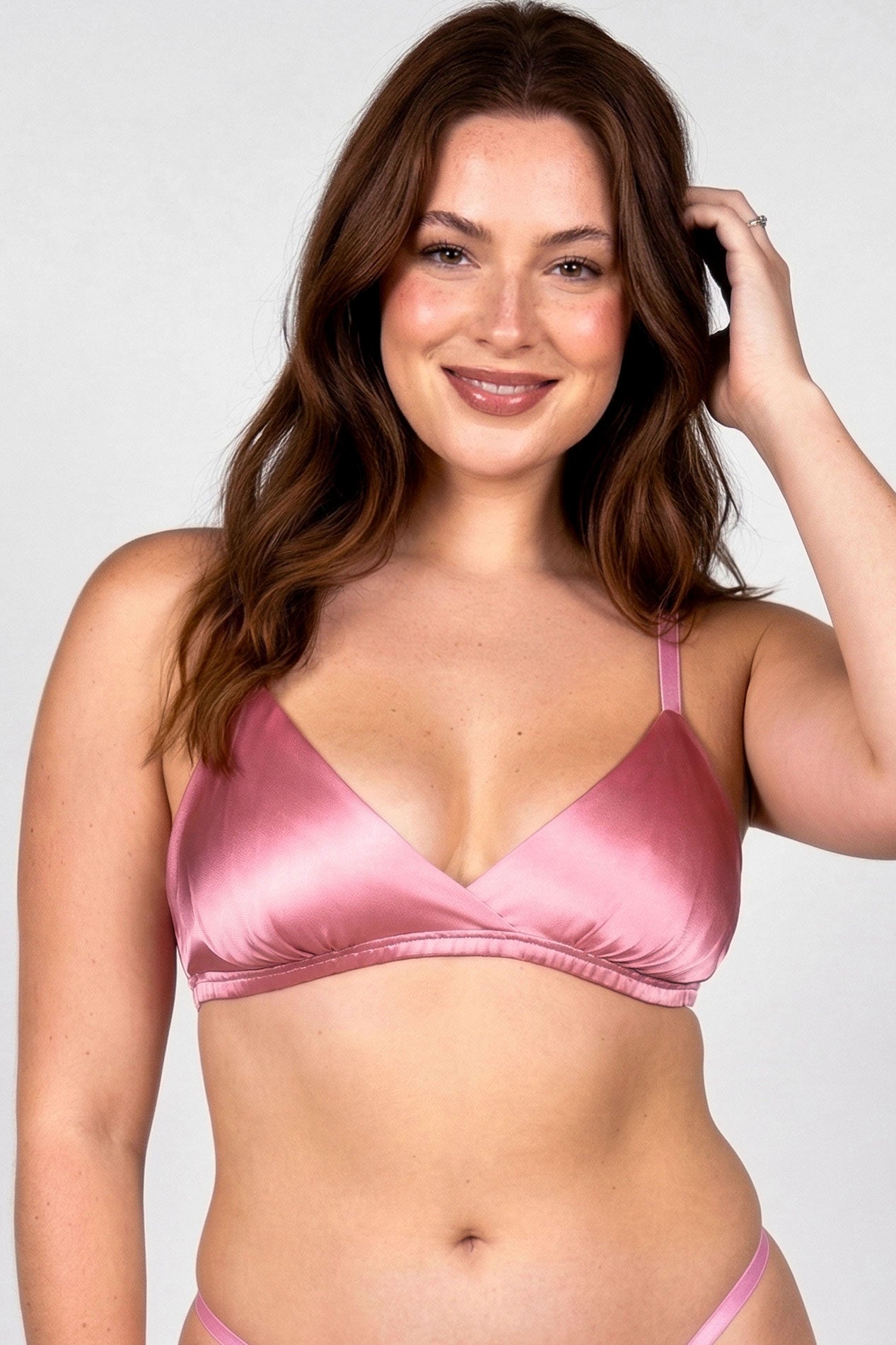 Luxury designer bra in pink silk satin with a ruched elastic band and matching silk underwear