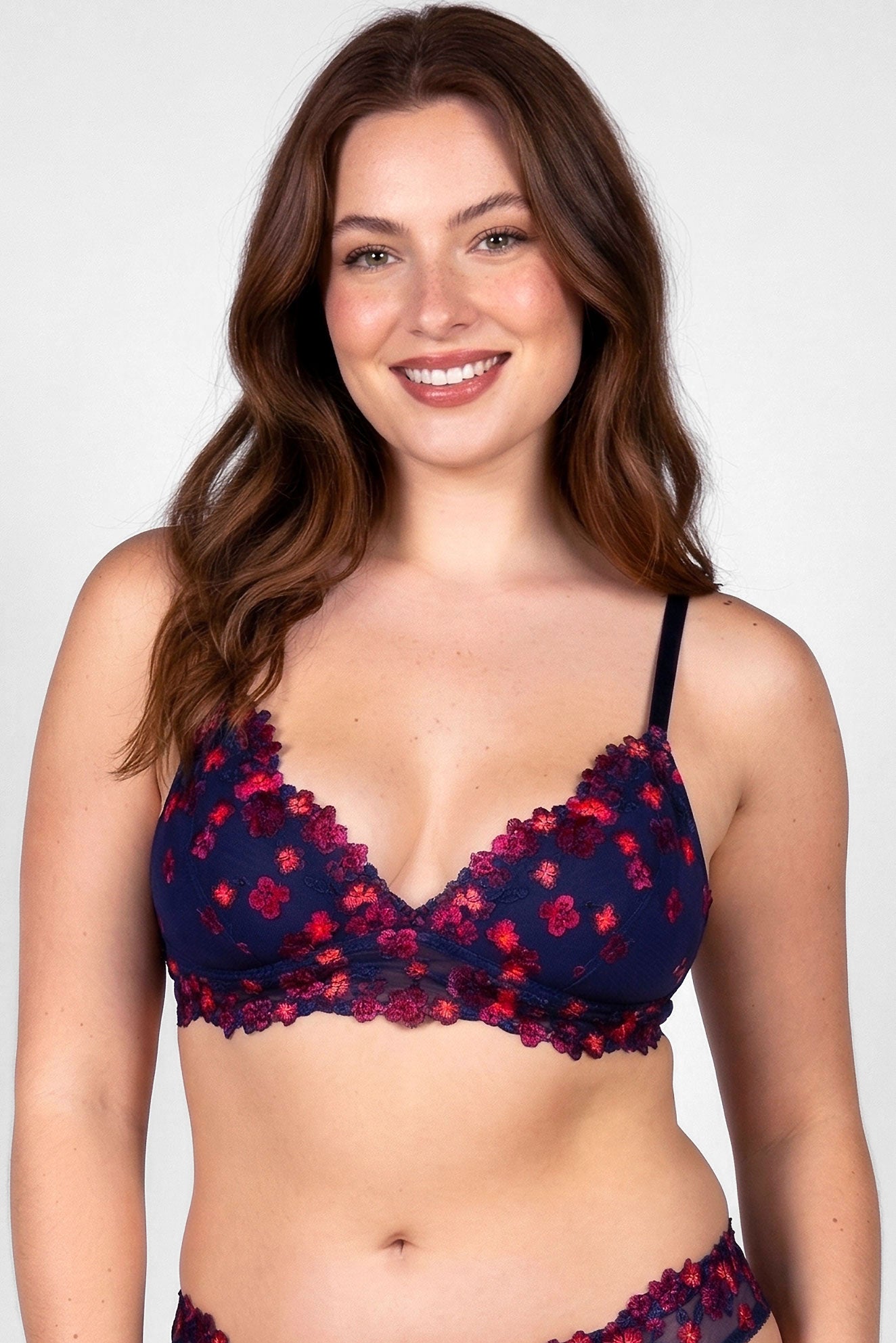 Lydia bralette in navy and neon orange with black-light reactive embroidered flowers overlay