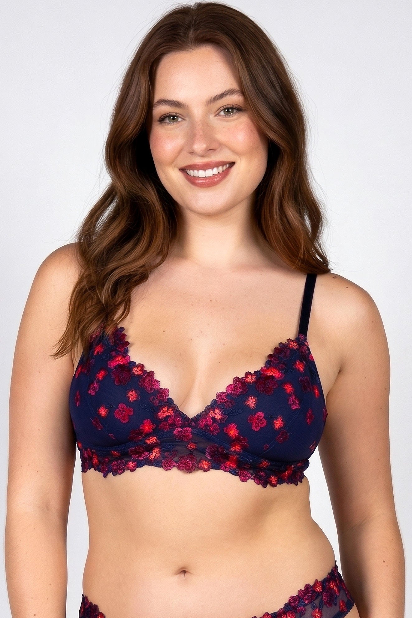 Lydia bralette in navy and neon orange with black-light reactive embroidered flowers overlay