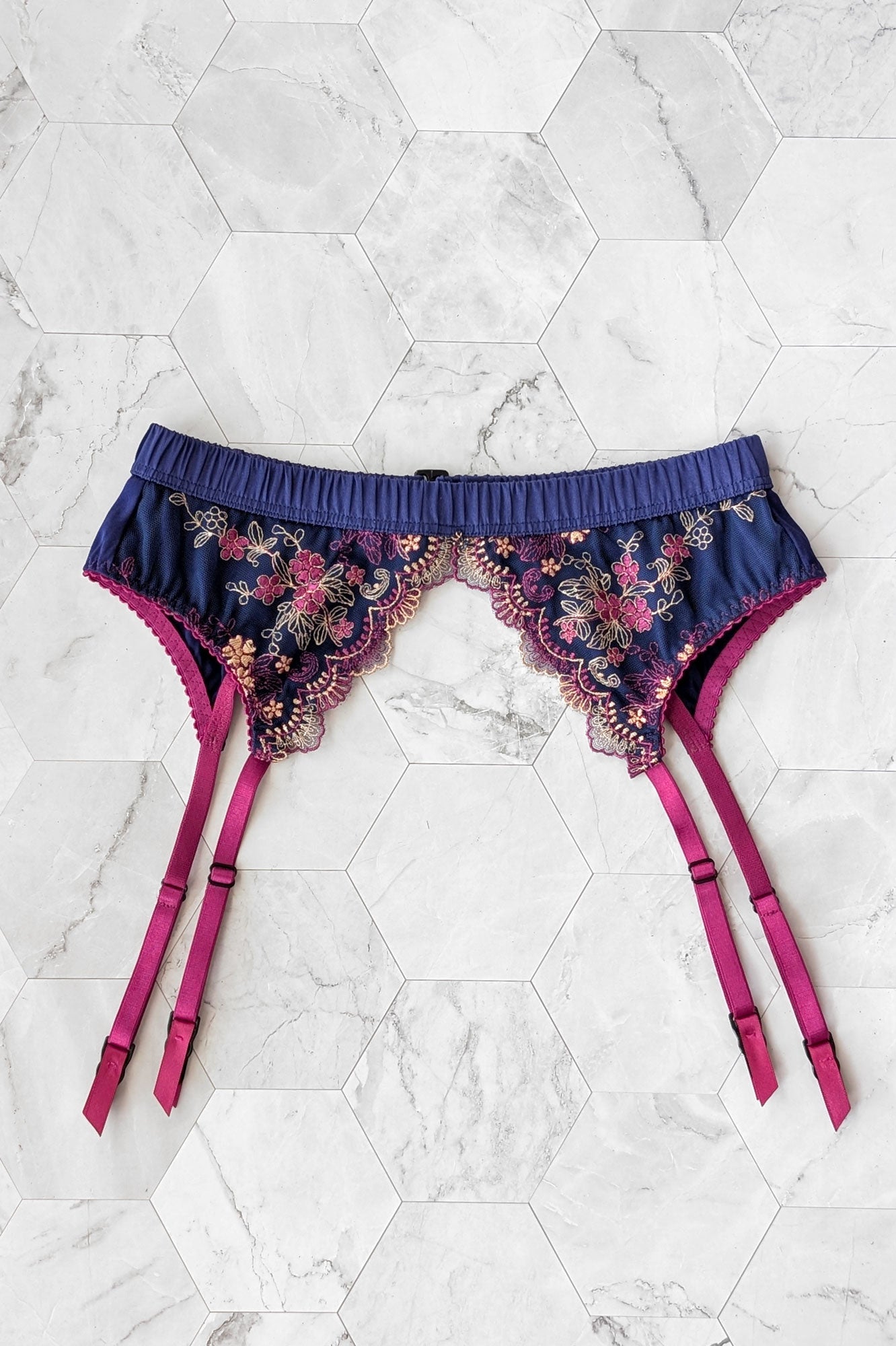 Floral garter belt with magenta straps and embroidered blue silk waistband