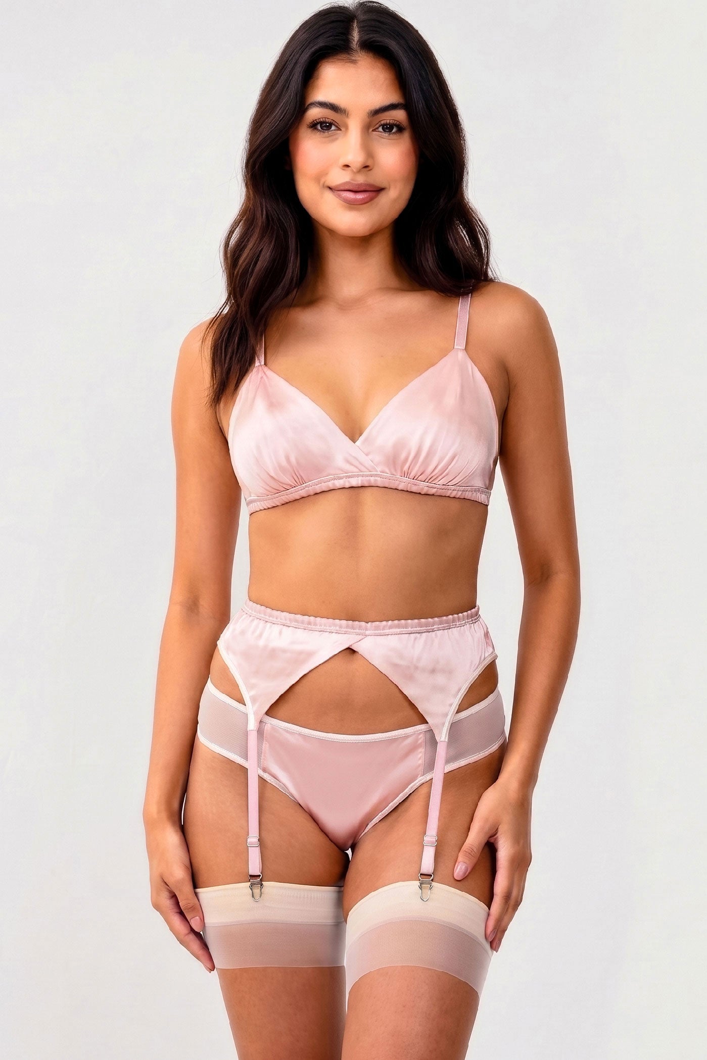 Designer 3 piece lingerie set, featuring a pale pink bralette, 4 strap garter belt, and low-rise mesh and silk panties