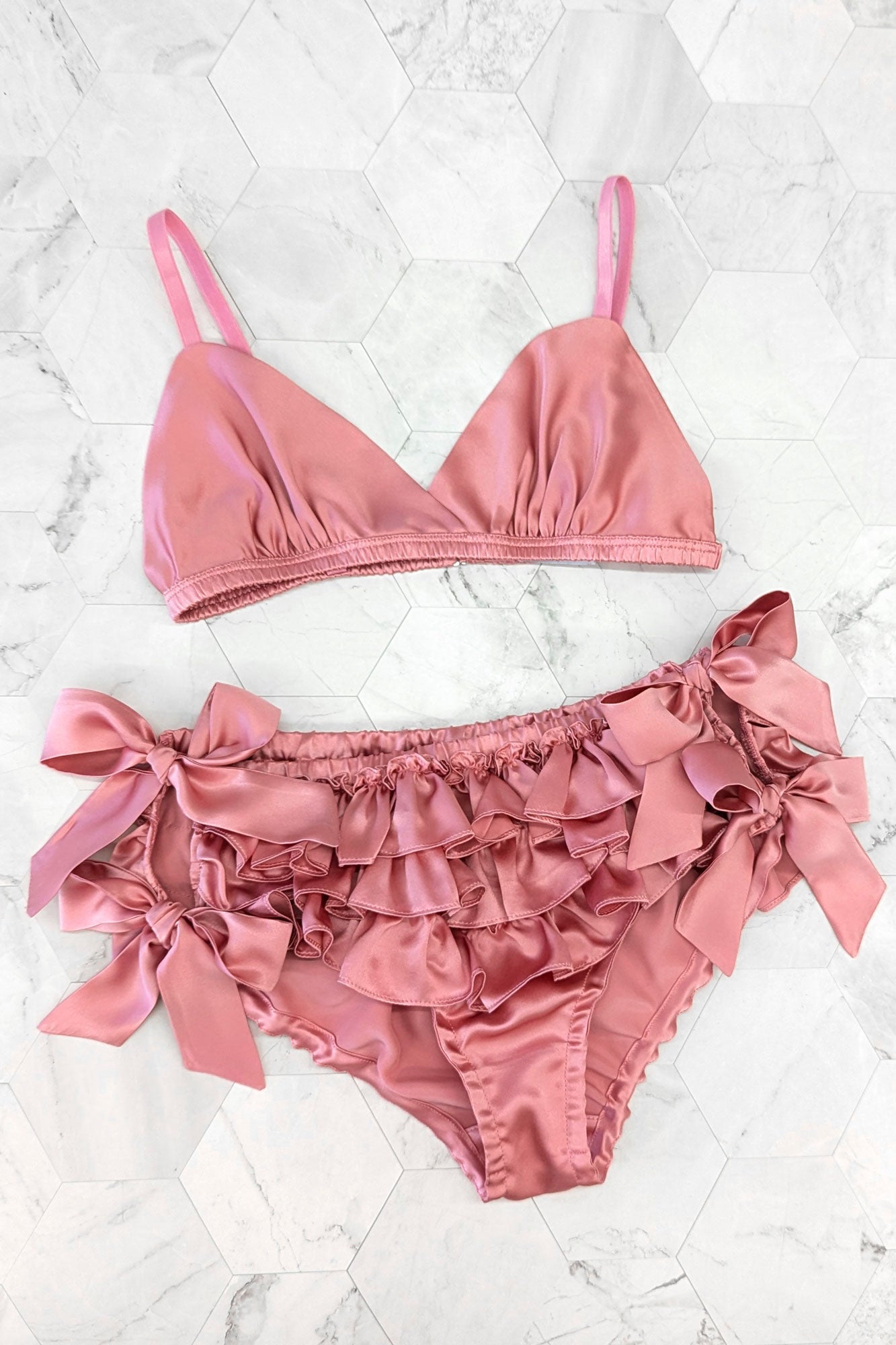 100% silk lingerie set with a pink satin bralet and rose silk ruffled panties
