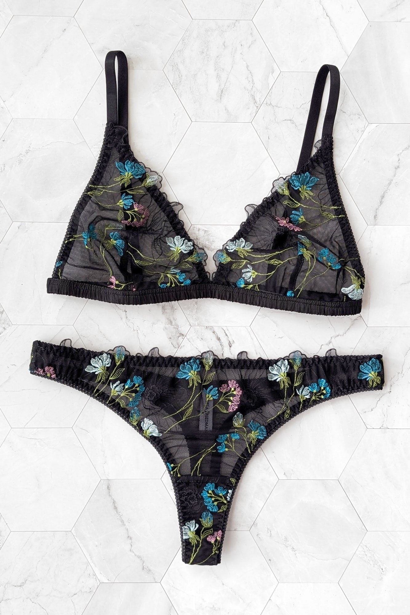 Colorful designer lingerie set with a sheer embroidered bra and low-rise thong knickers in black mesh