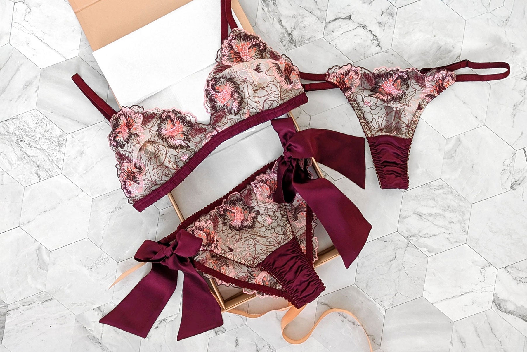 3 piece luxury lingerie set with a sheer floral bra and silk panties