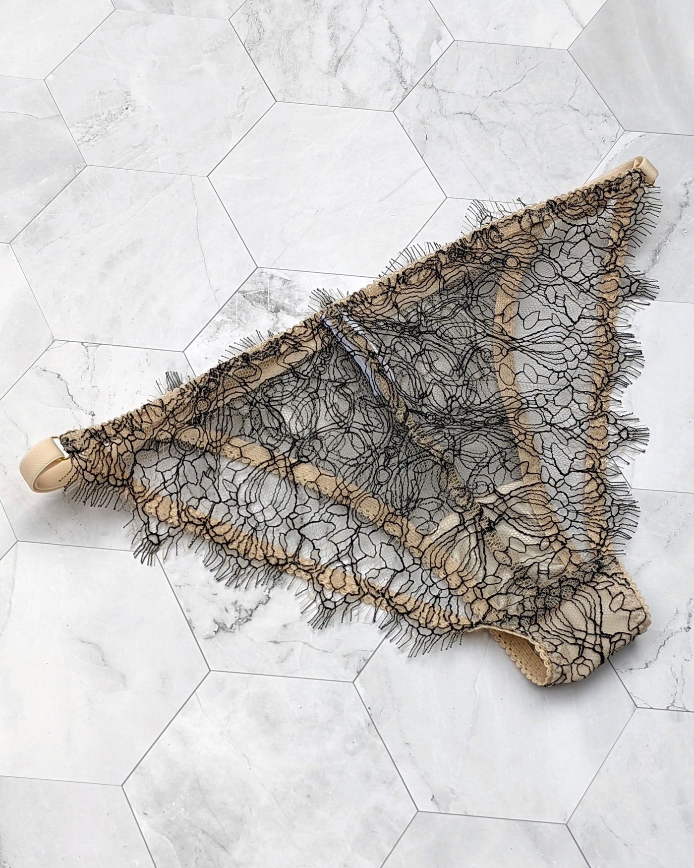 French lace panties in black and sheer nude trims with a geometric design