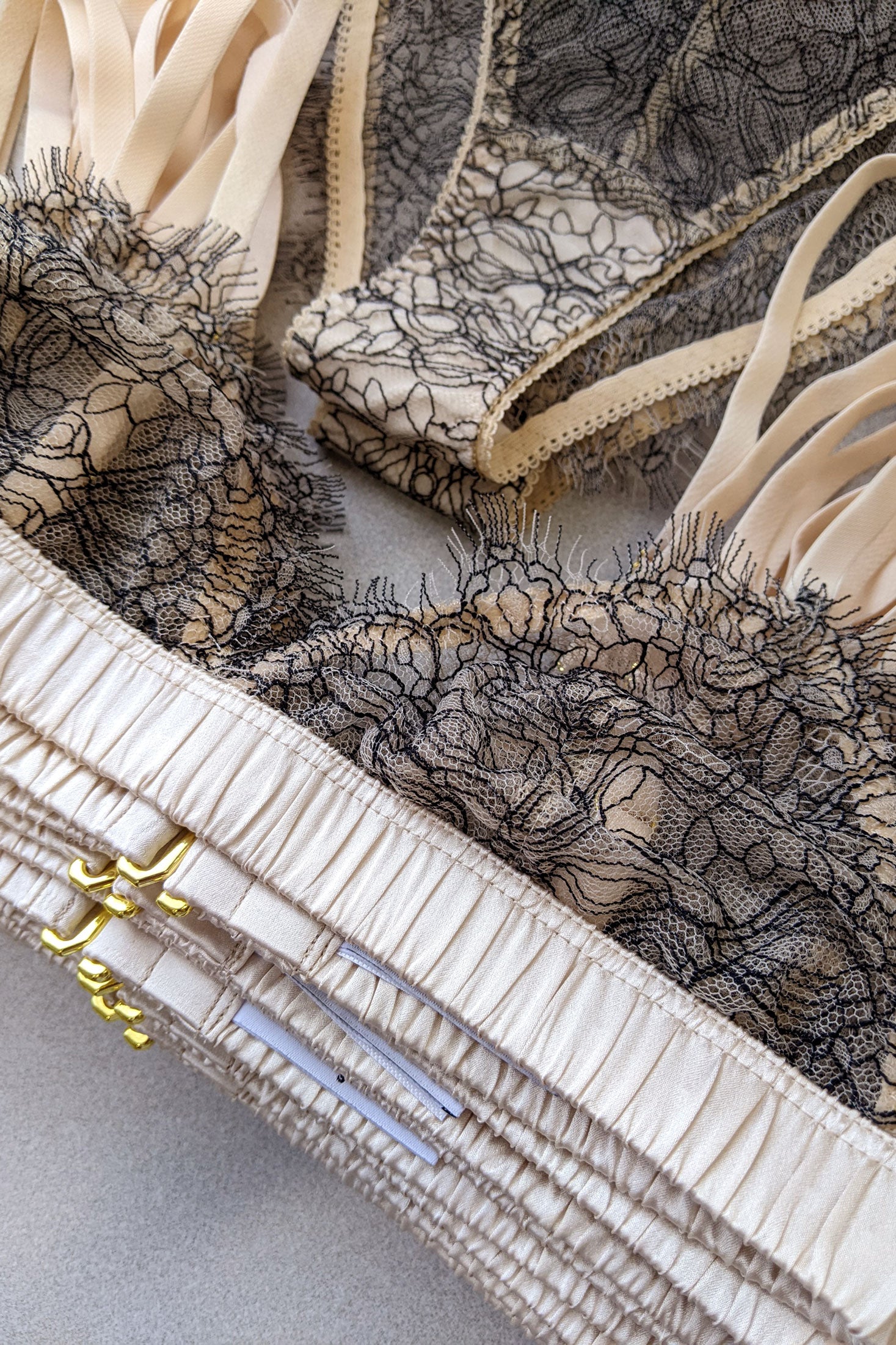 Stack of designer silk bras by Angela Friedman London