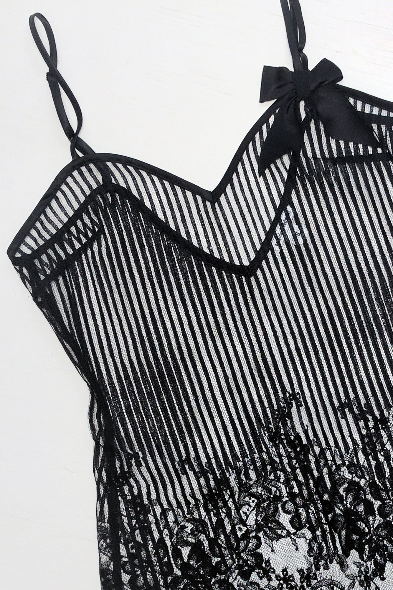 French lace lingerie with a black floral striped lace slip