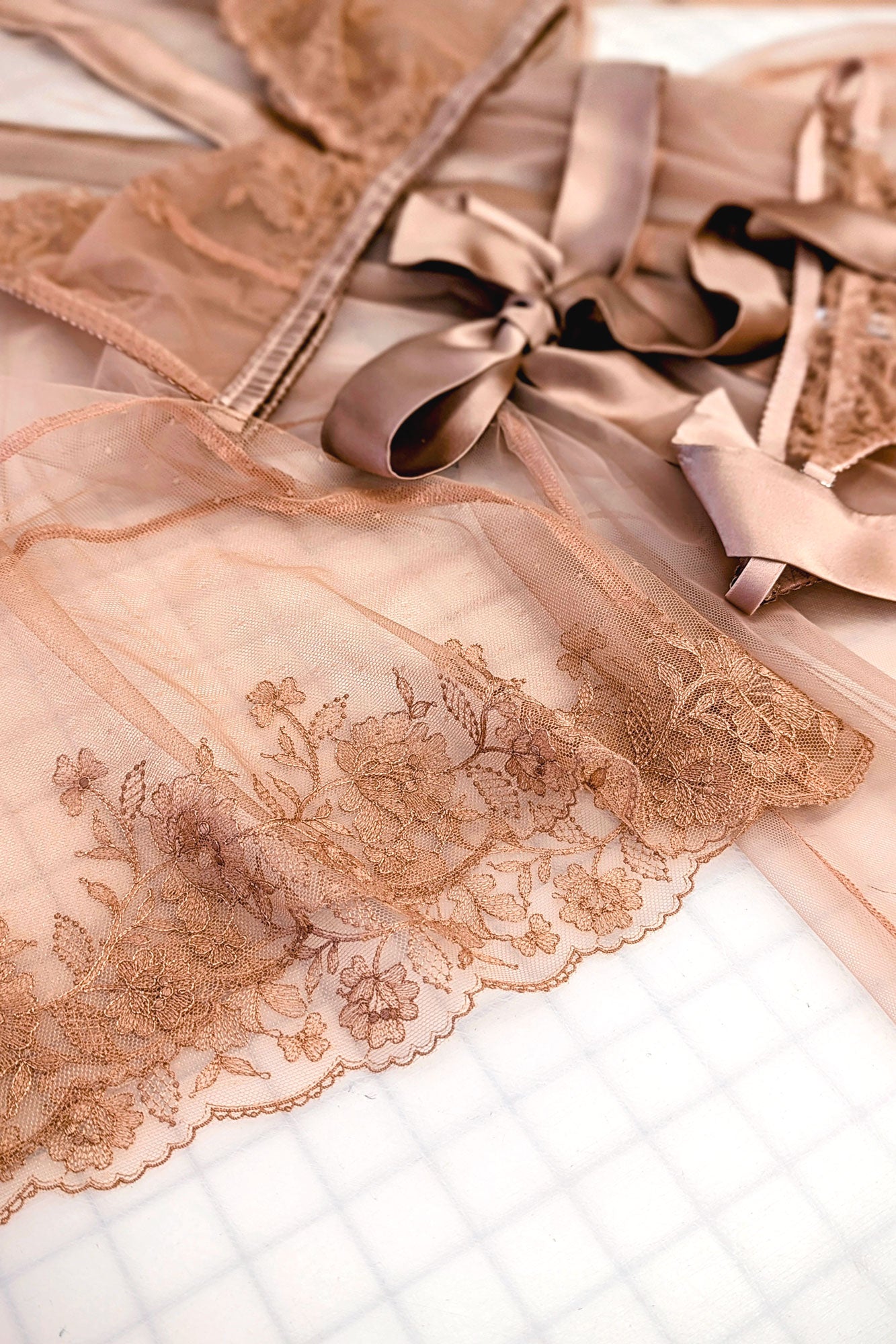 Silk and lace lingerie set with a sheer dressing gown overlay, in blush pink with apricot floral trims