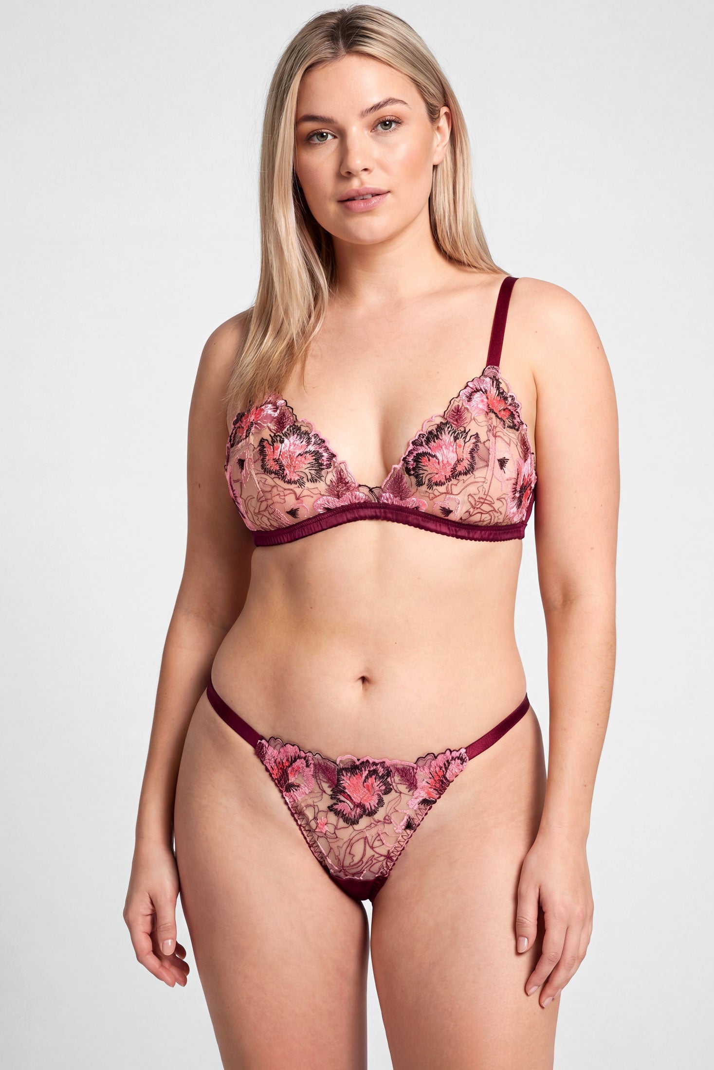 Luxury lingerie set in wine red silk with floral embroidered bra cup and a g-string thong with adjustable straps