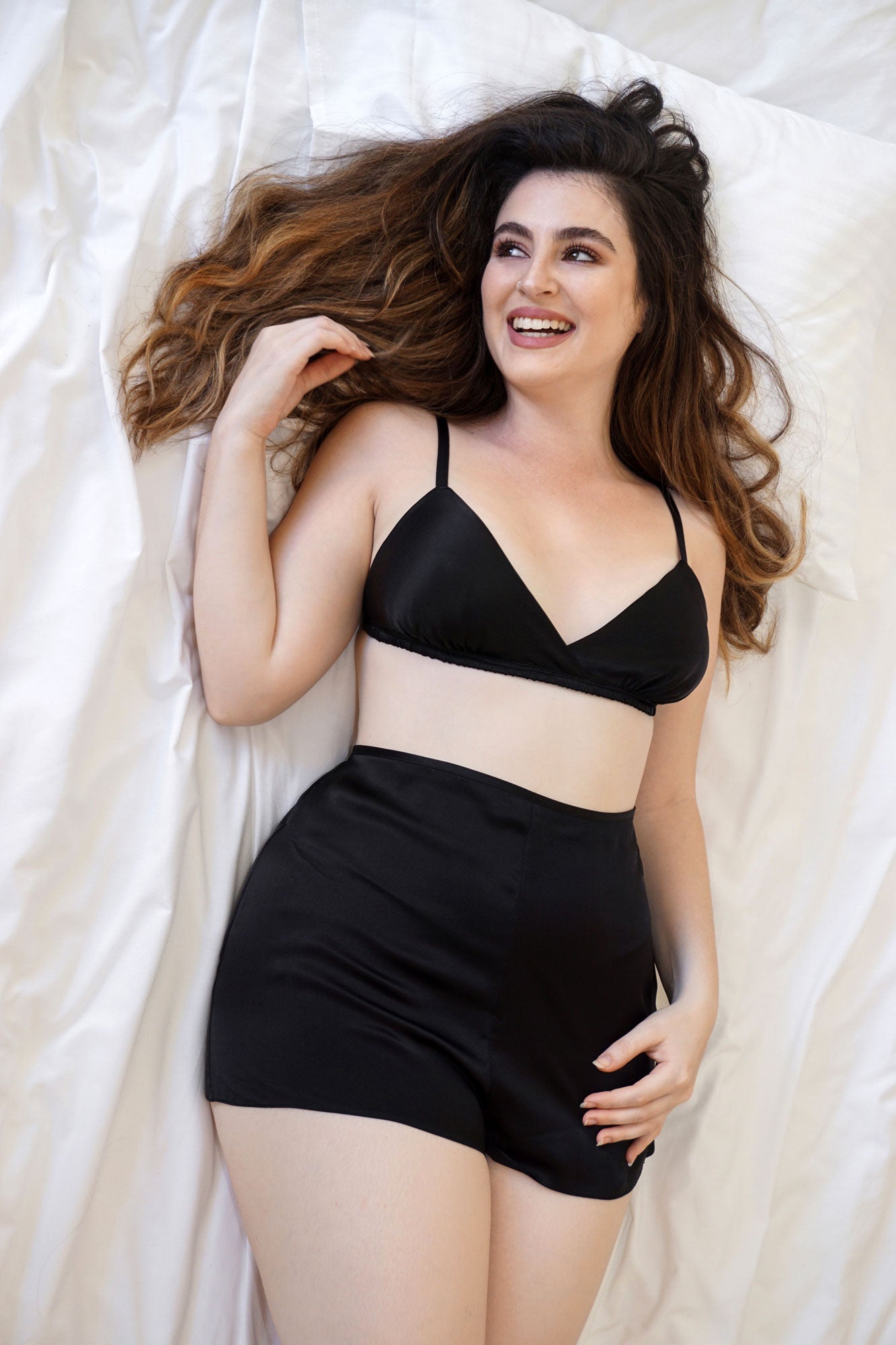 Luxury sleepwear set with a triangle bra and silk tap pants in black satin