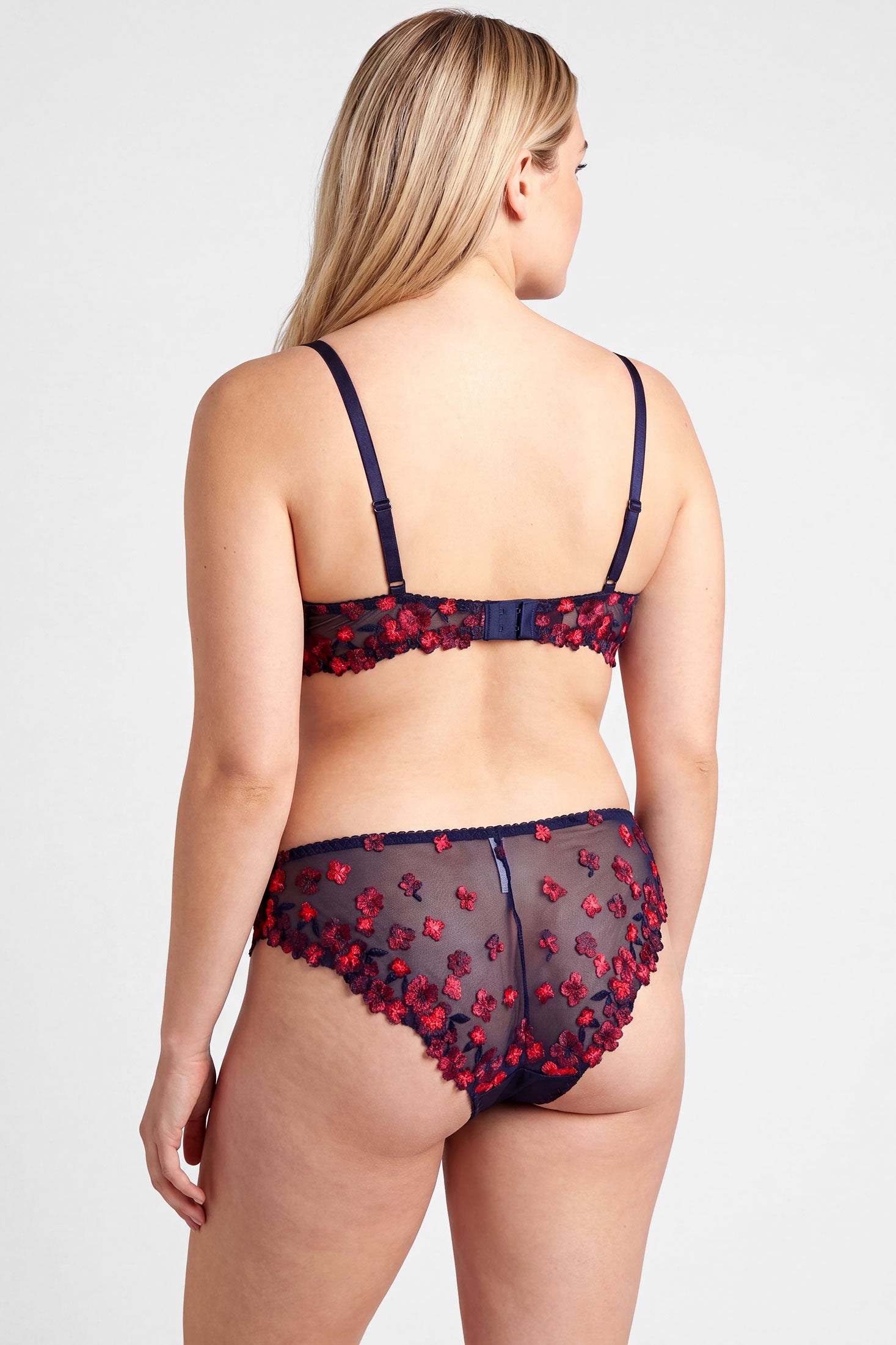 Luxury lingerie set with embroidered flowers and blacklight reactive threads
