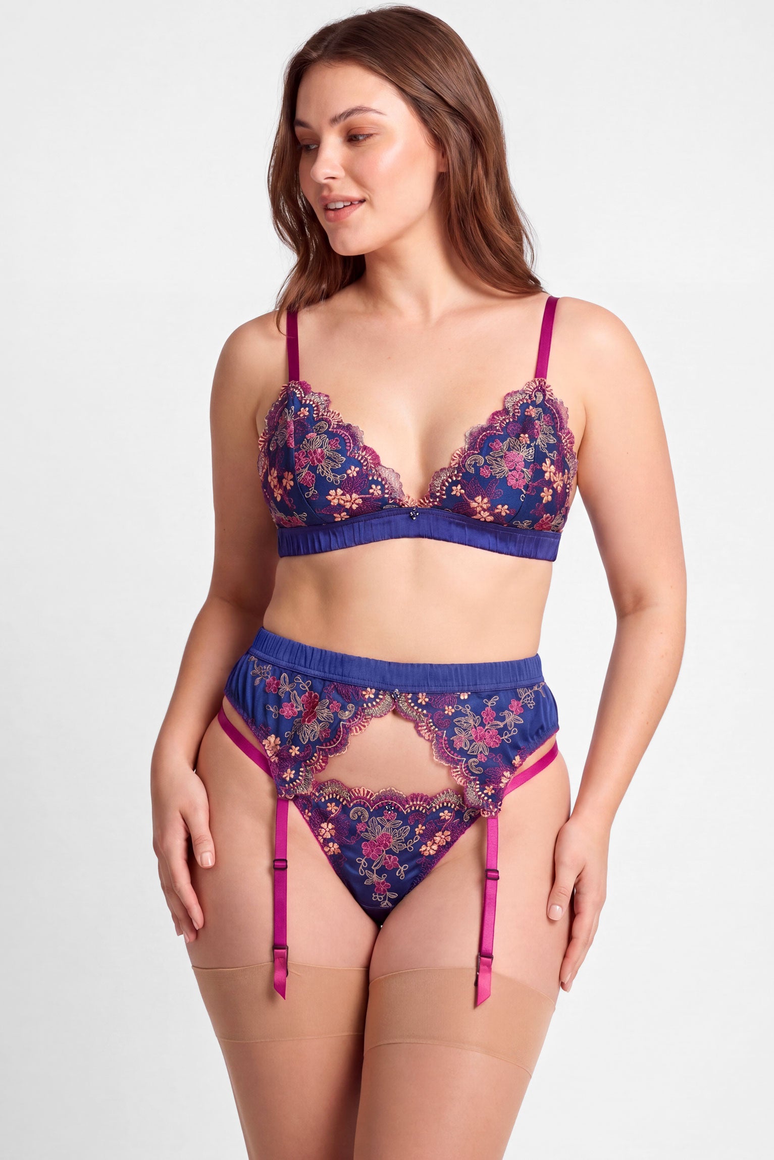 Blue and pink bra, panties, and garter belt set with silk embroidery by luxury lingerie designer Angela Friedman