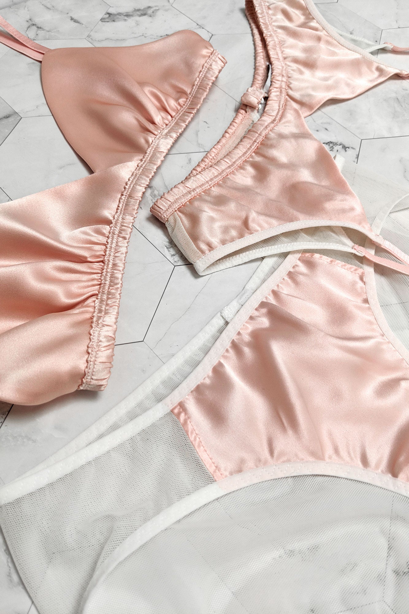 3 piece lingerie set by luxury designer Angela Friedman, featuring a silk bra and suspender belt set
