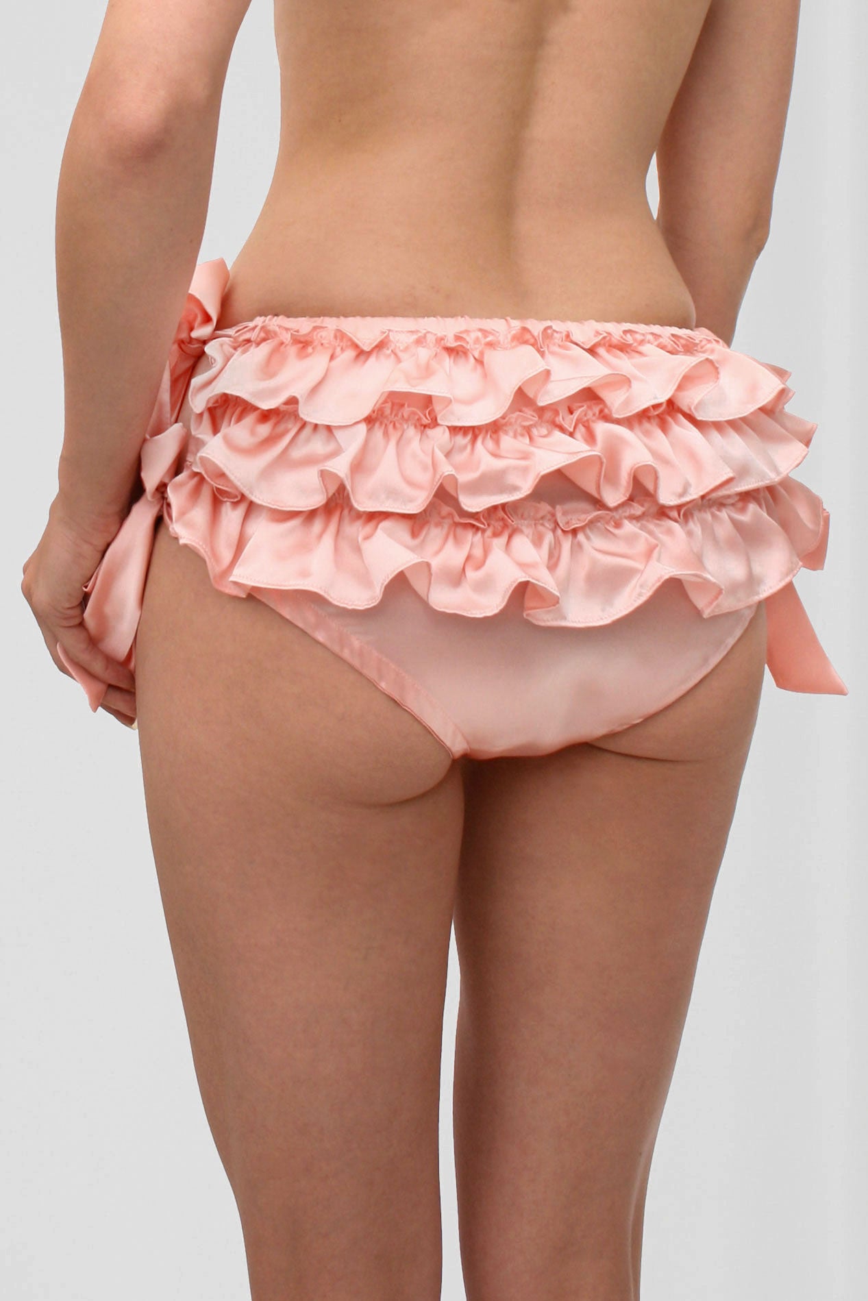 Frilly pink silk underwear with ruffles on the back
