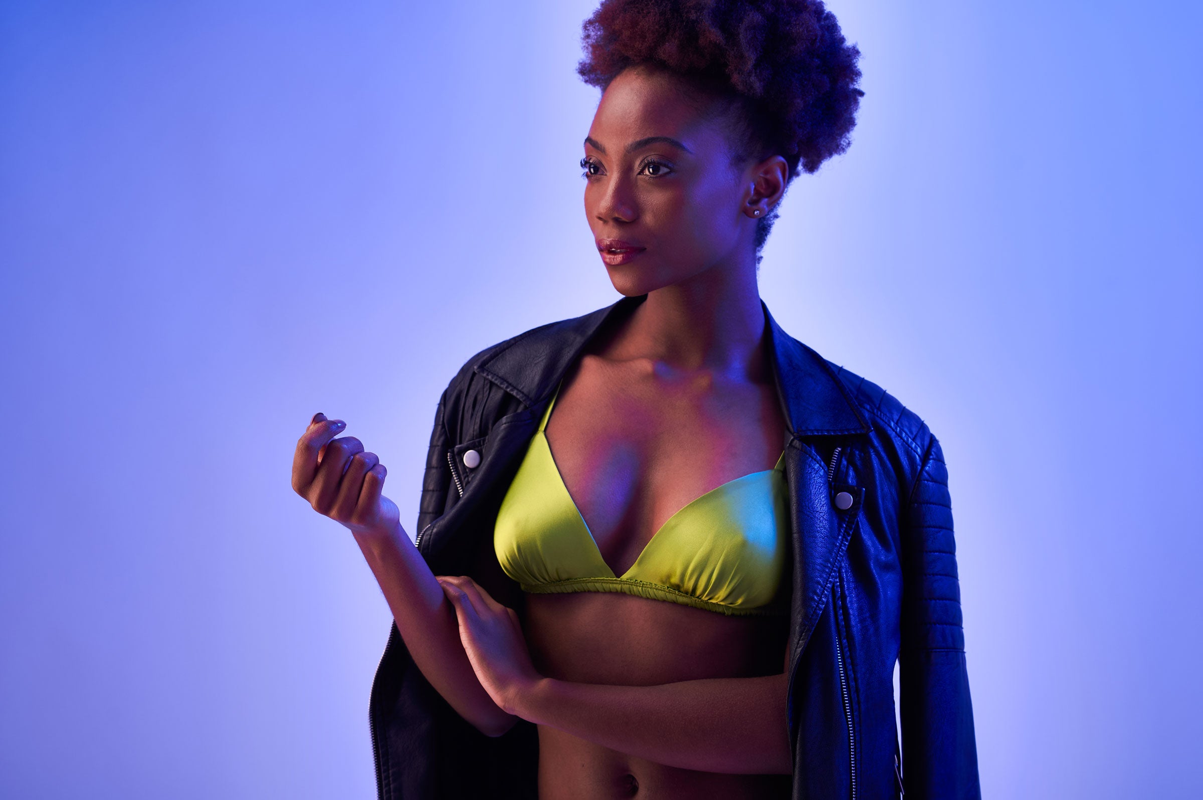 Chartreuse green silk bralette and leather jacket