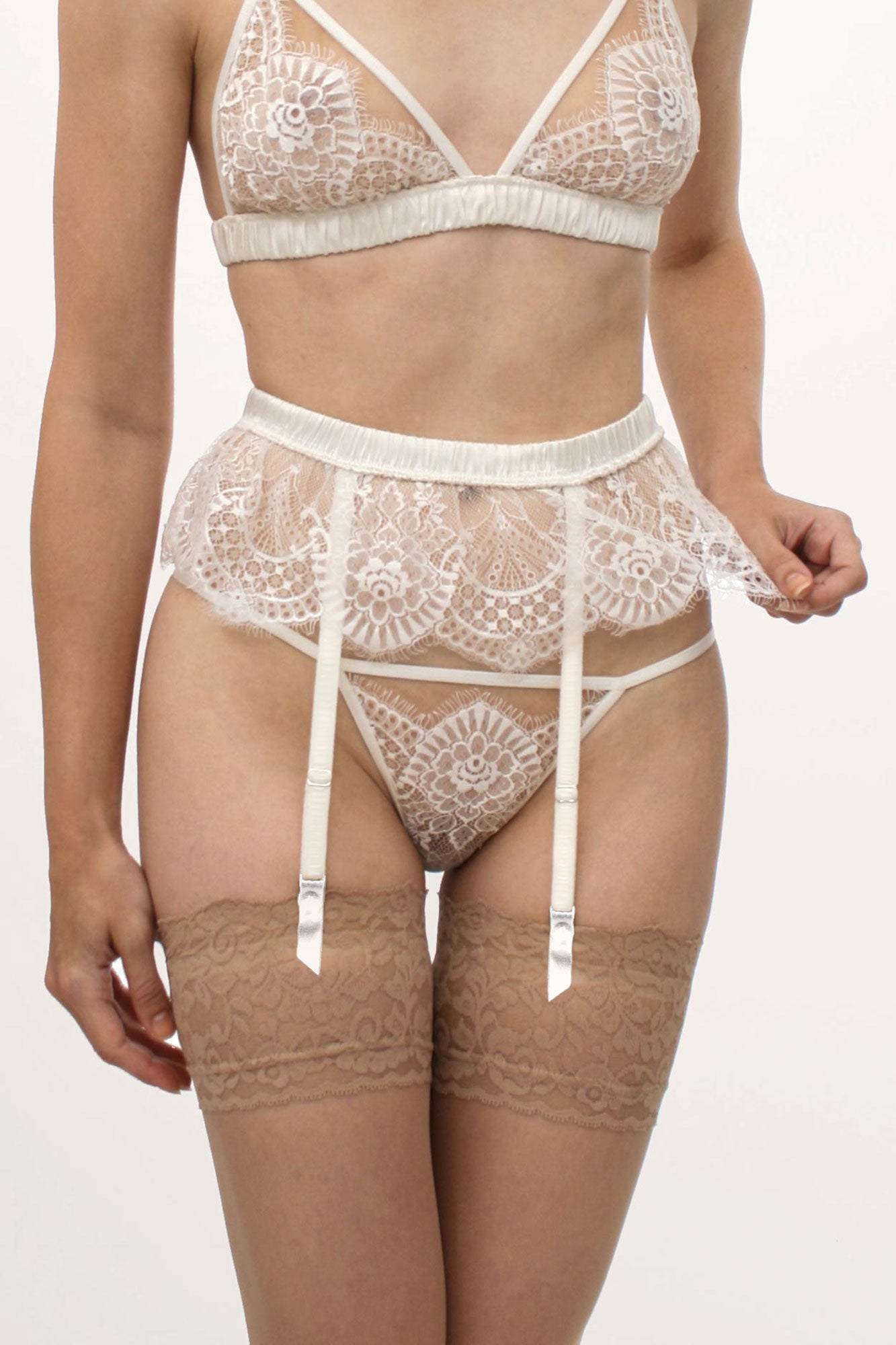 White lace suspender belt and garters for a bride on her wedding night