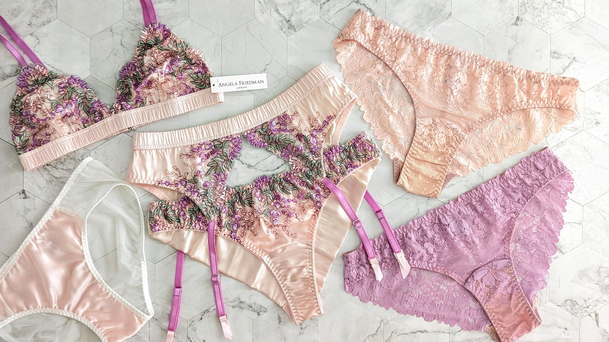 Pink lace and silk garter belts and luxury underwear sets