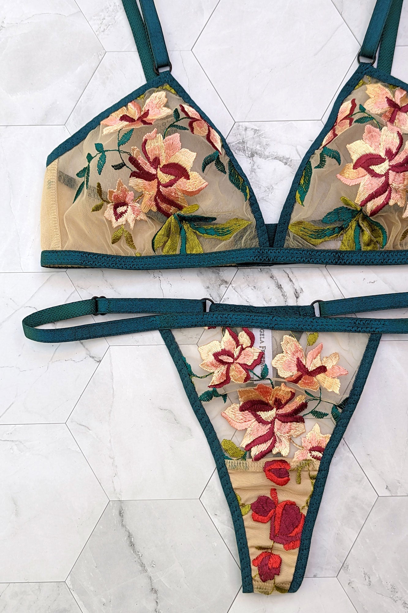 Camellia bra and thong set with pink flower embroidery and teal blue elastic straps