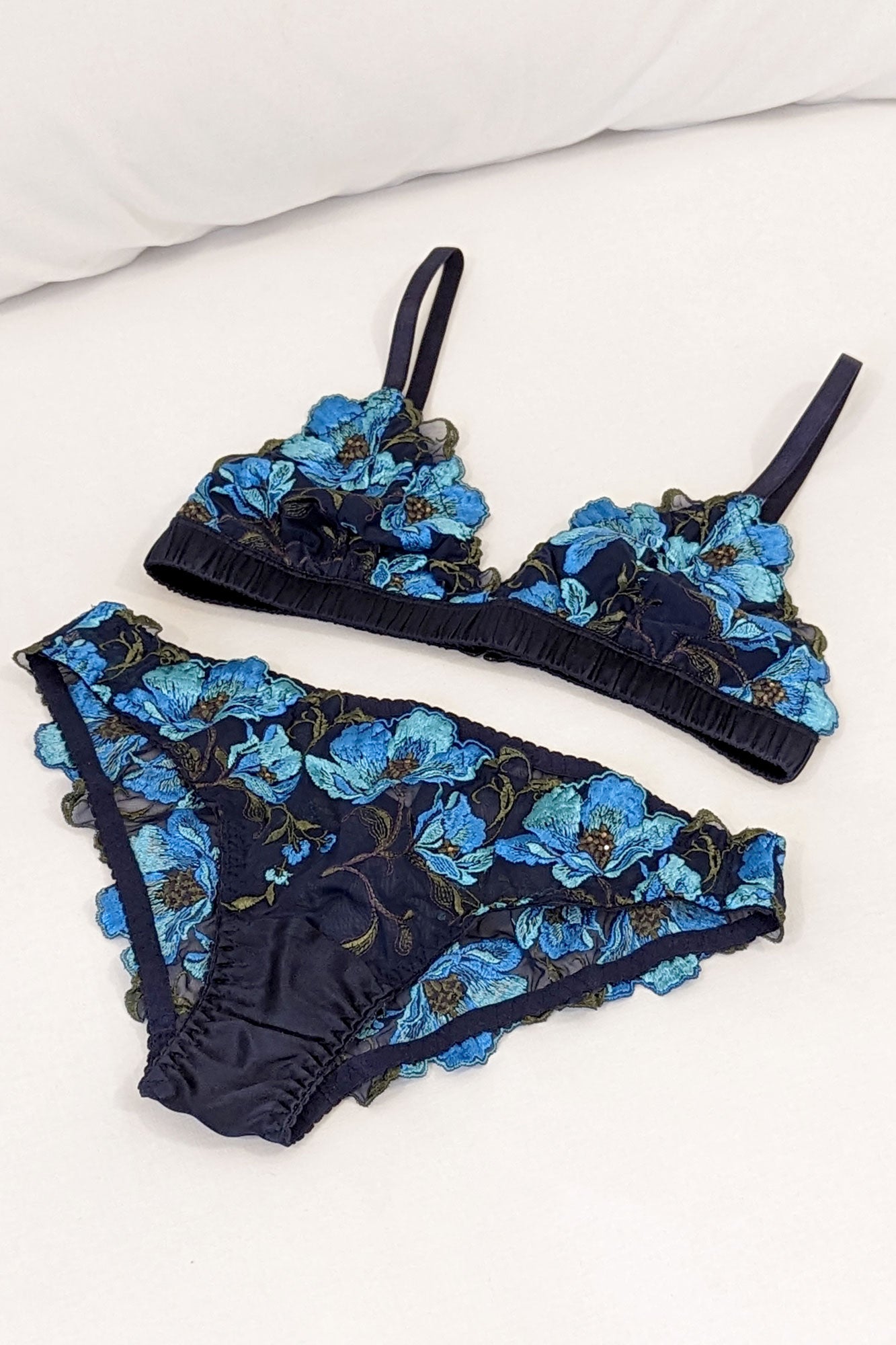 Handmade silk underwear set with an embroidered bralette and flower trimmed knickers