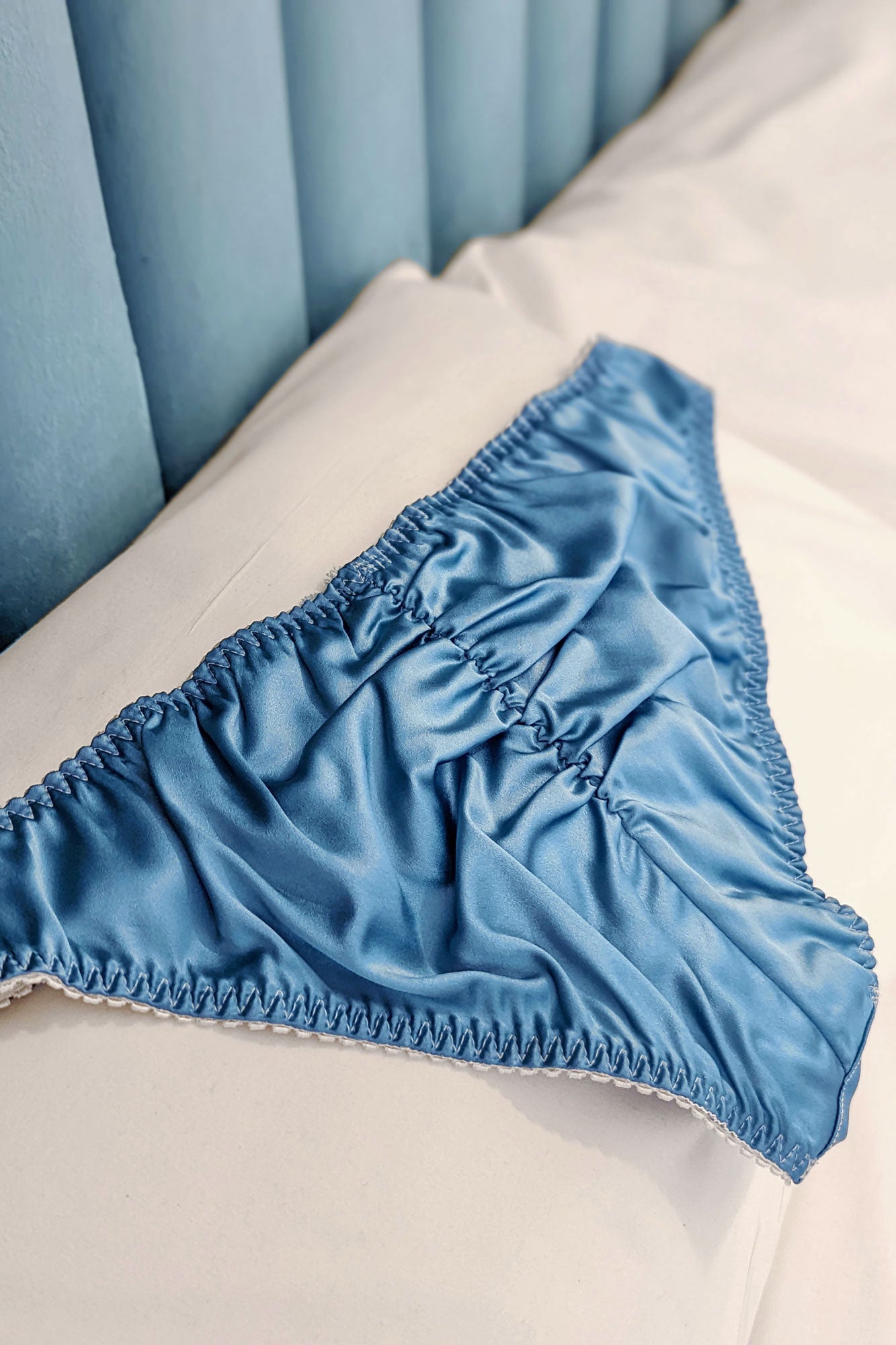 Blue silk panties with ruched back detailing and embroidered floral lace