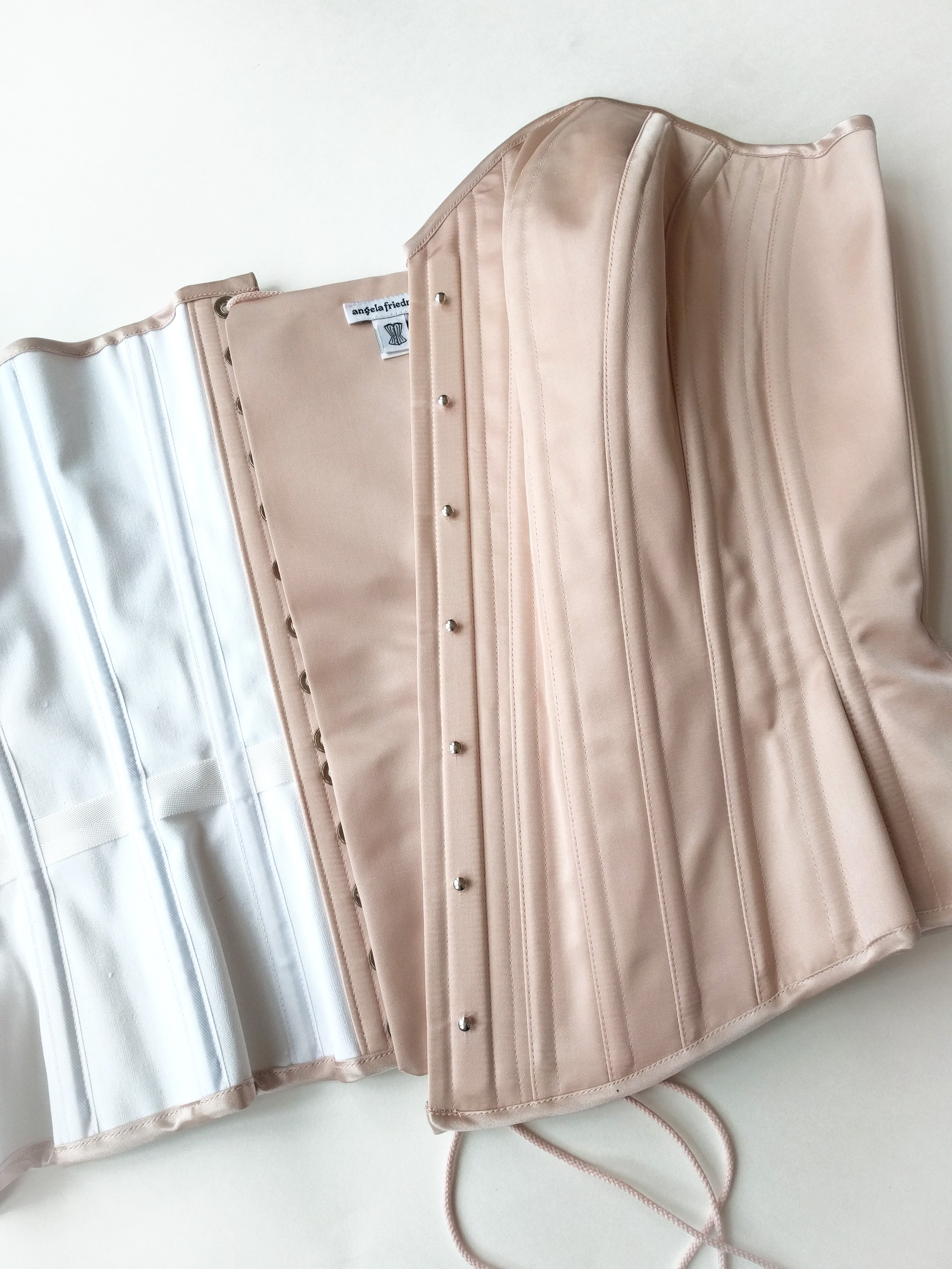 Pink corsets in 100% silk satin by vintage style corset designer Angela Friedman