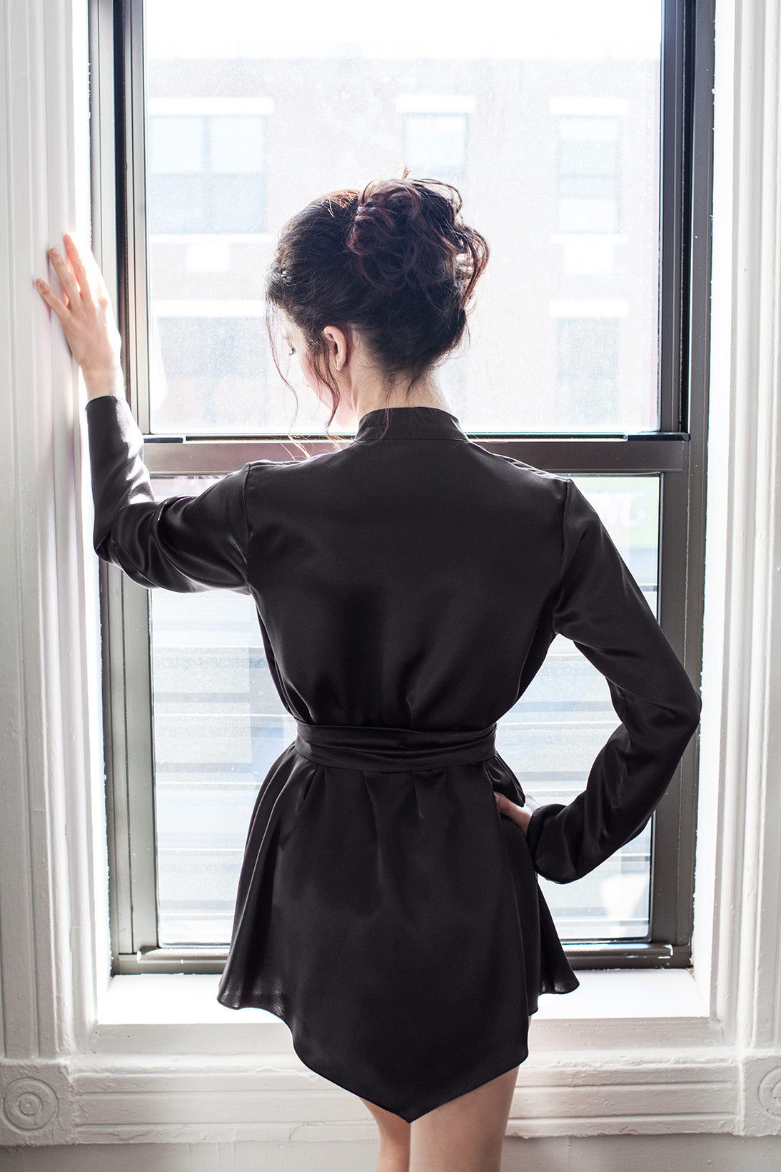 Back of a black satin robe in 100% pure silk