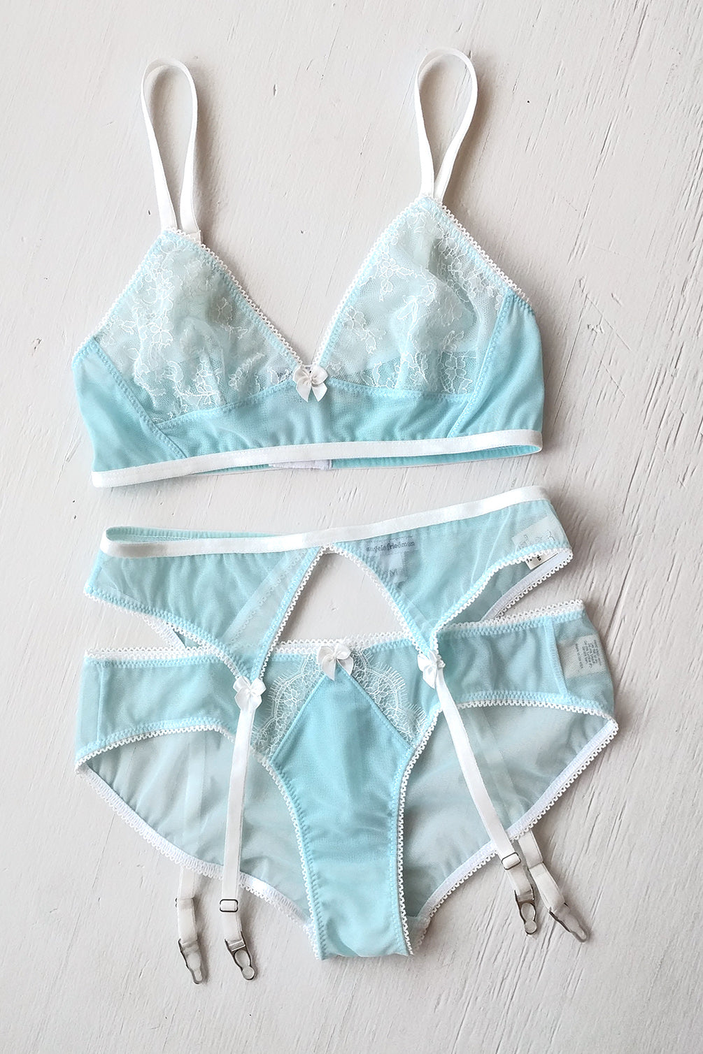 Bridal garter set and suspender belt in blue sheer mesh