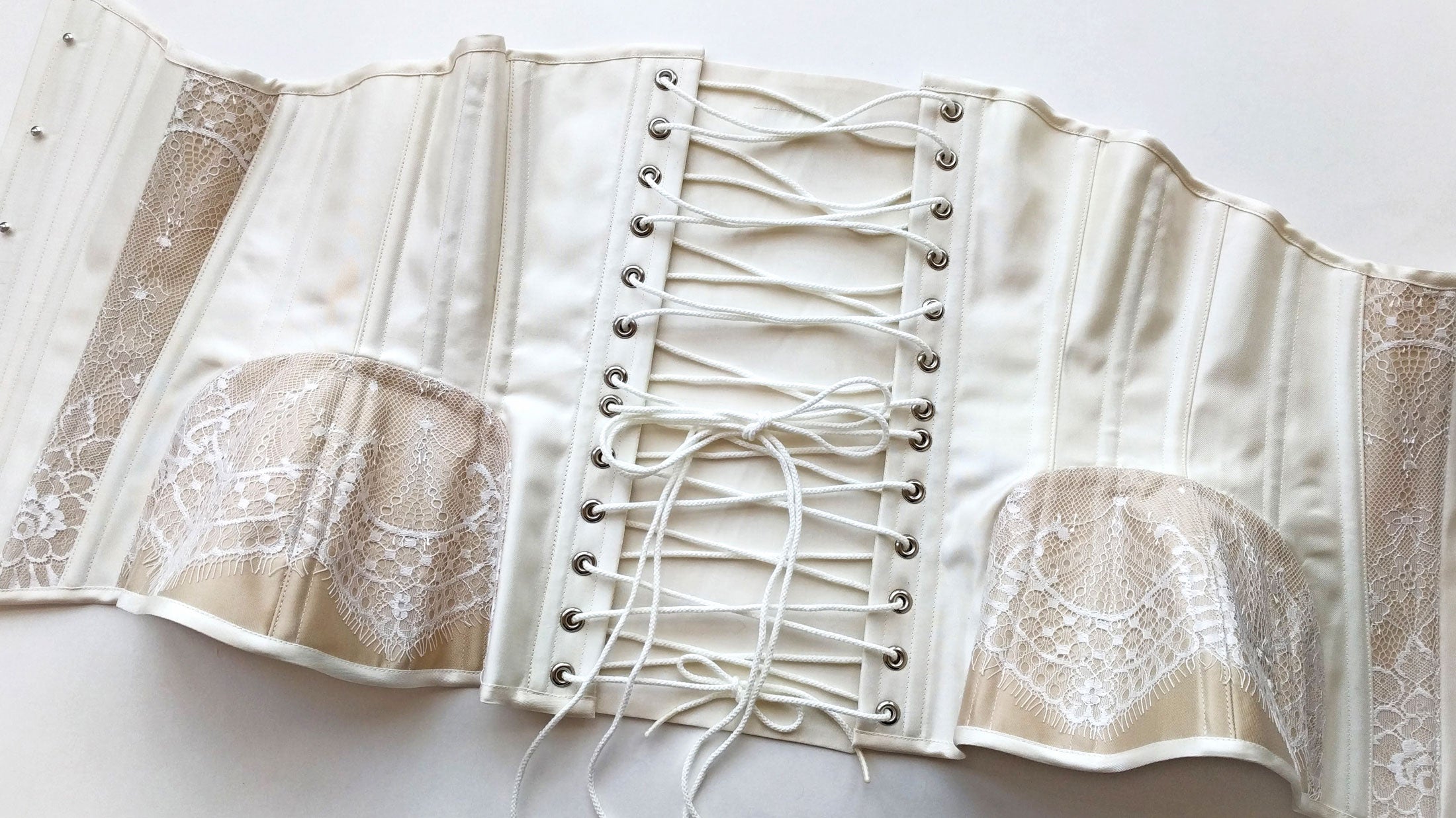 White silk bridal corset with eyelash lace trims