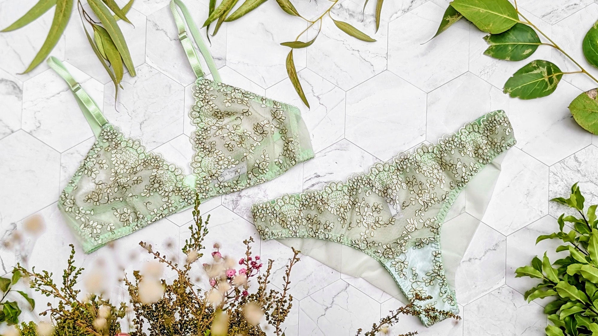 Green mesh lingerie set with embroidered floral overlays and pale mint sheer mesh