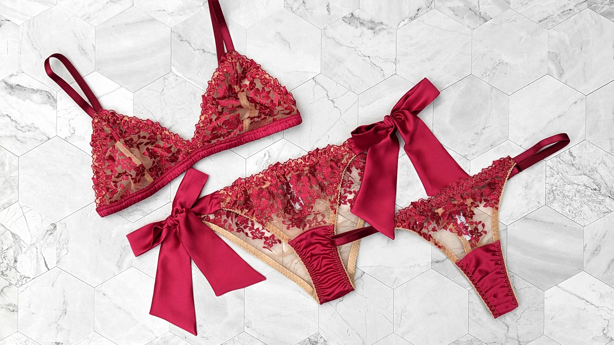 Red Valentine's Day lingerie set with a lace bralette, side tie knickers, and silk thong