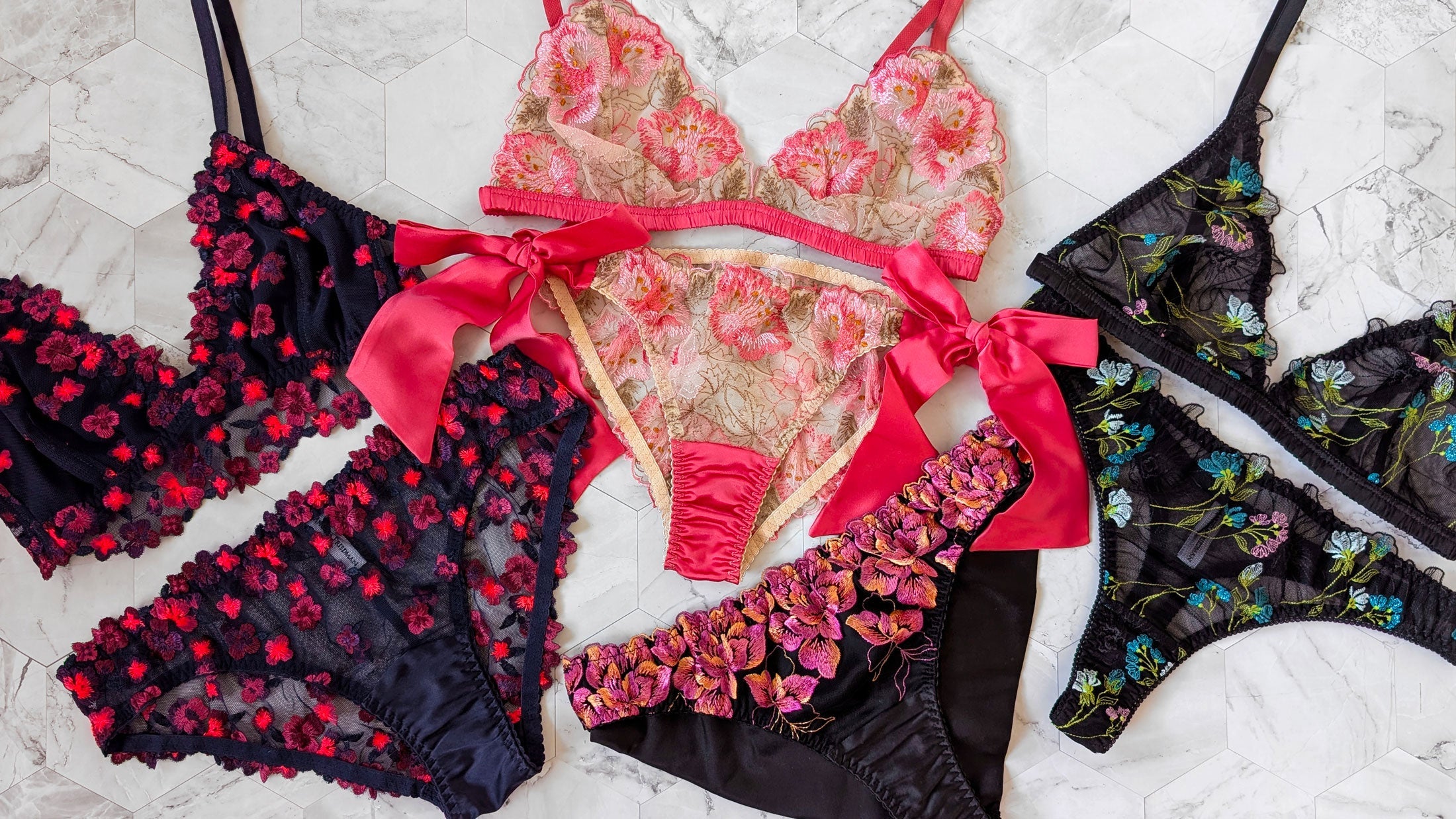 Bright colors of lingerie sets in neon pink, dayglow orange, bright blue, and green