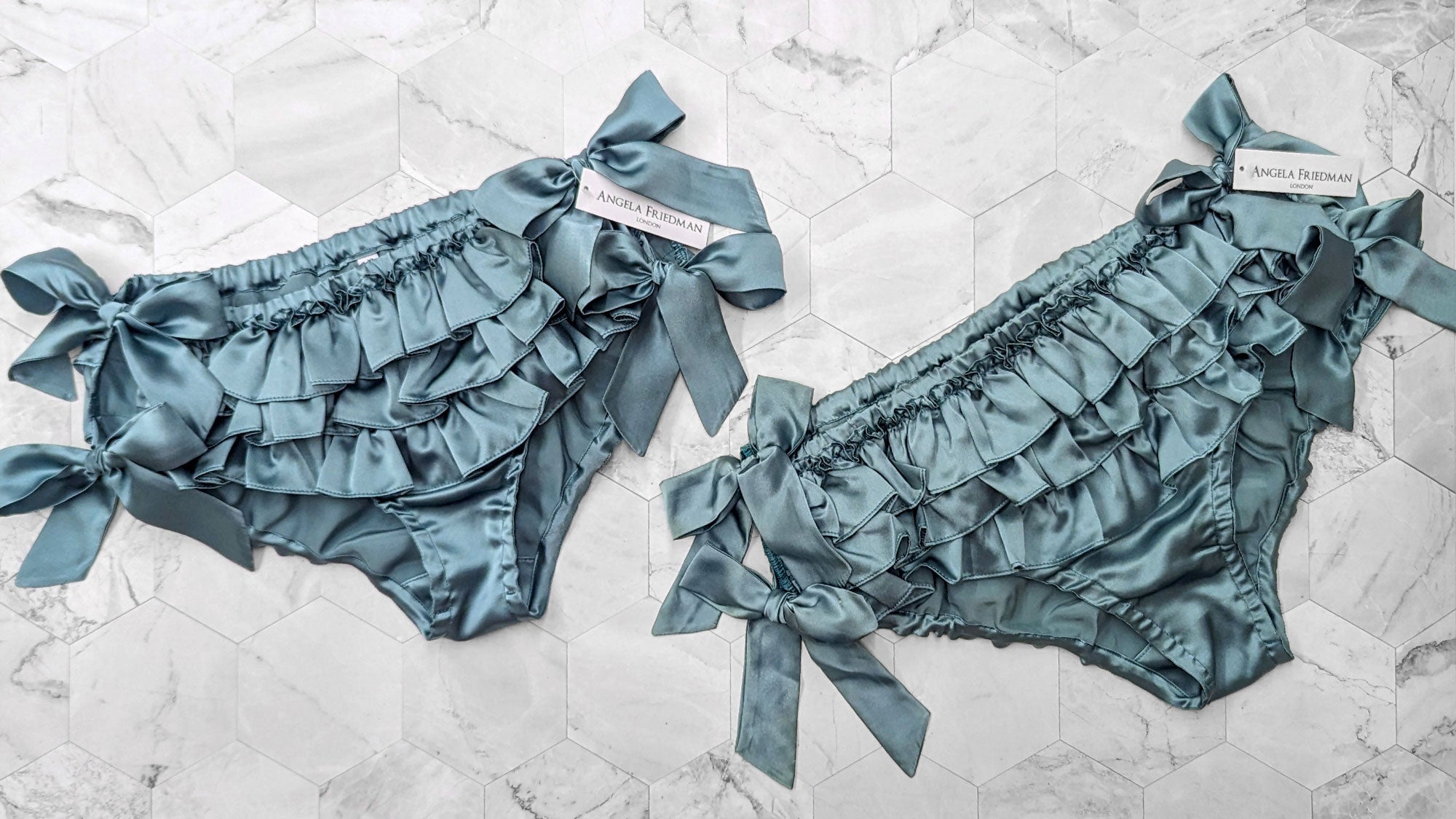 Silk ruffled panties in teal satin with side tie bows