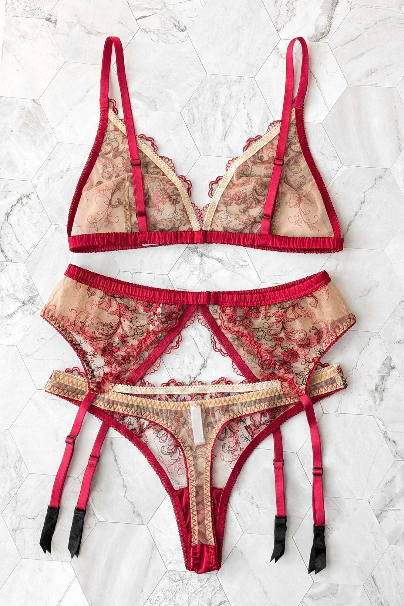 Red silk and nude mesh thong, suspender belt, and lace bralette