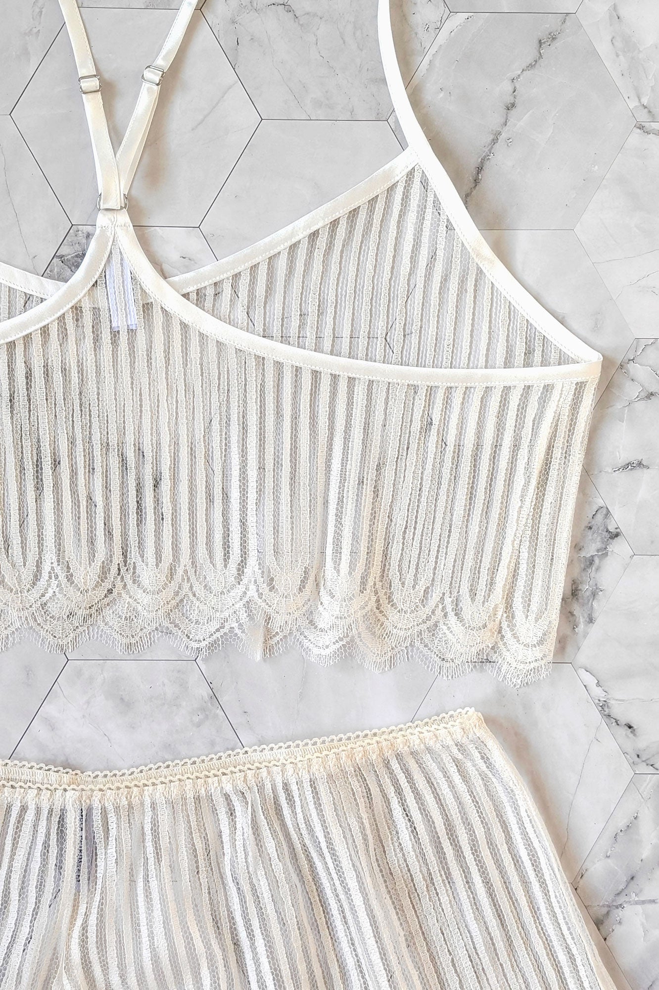 Sheer bridal trousseau including a white racerback camisole and soft lace knickers