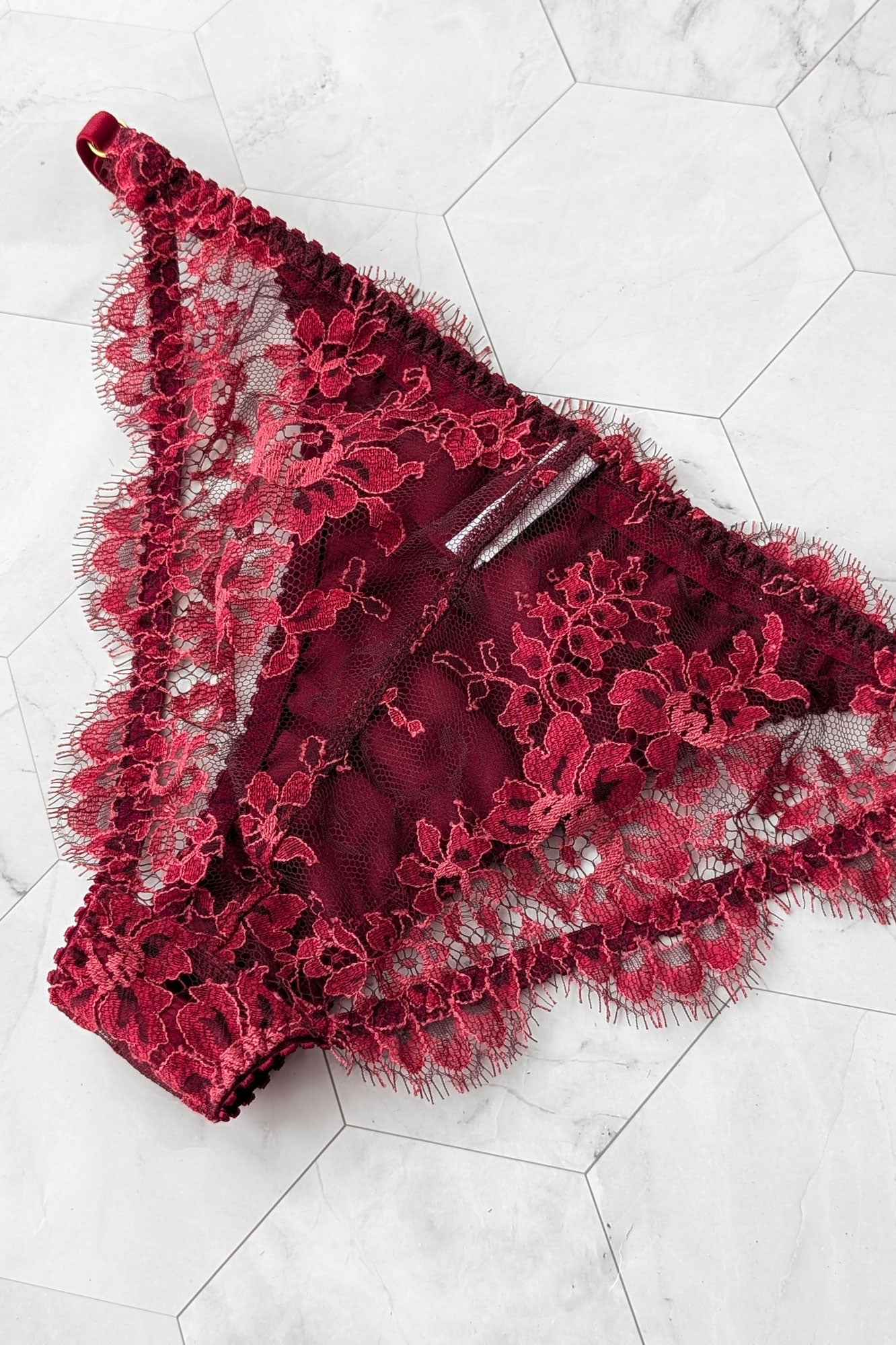 Garnet red silk knickers, showing a back view of the delicate French lace overlays with scalloped eyelash edges