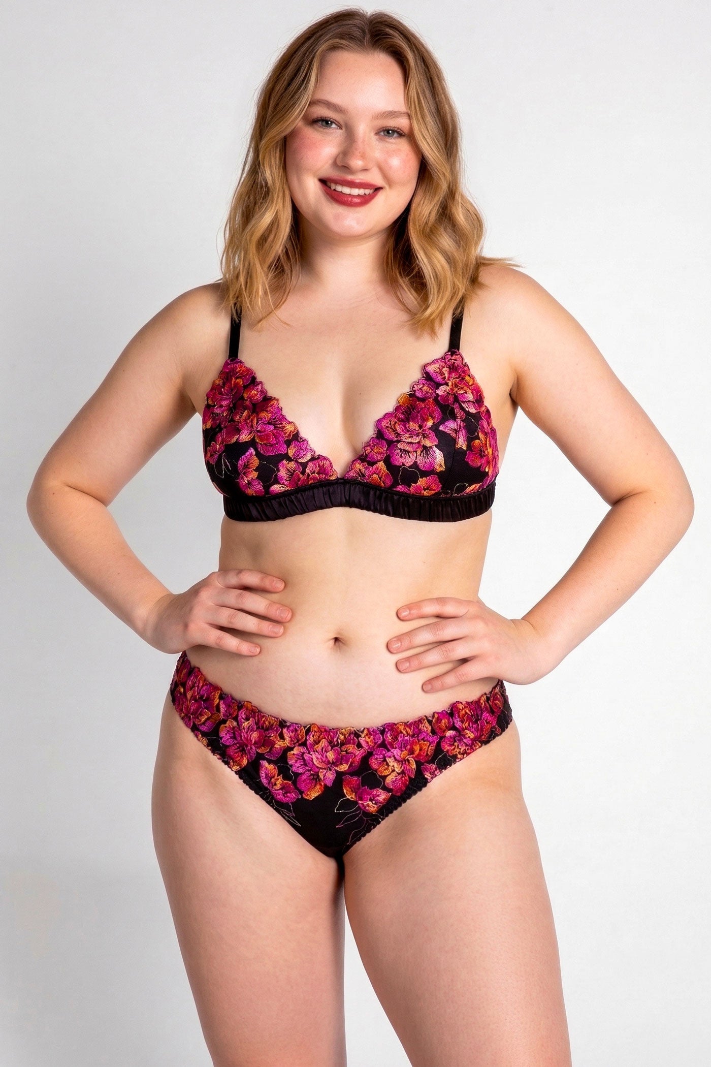 Designer silk lingerie set in black satin with pink flower embroidered overlays, cut in a triangle bra style with cheeky knickers