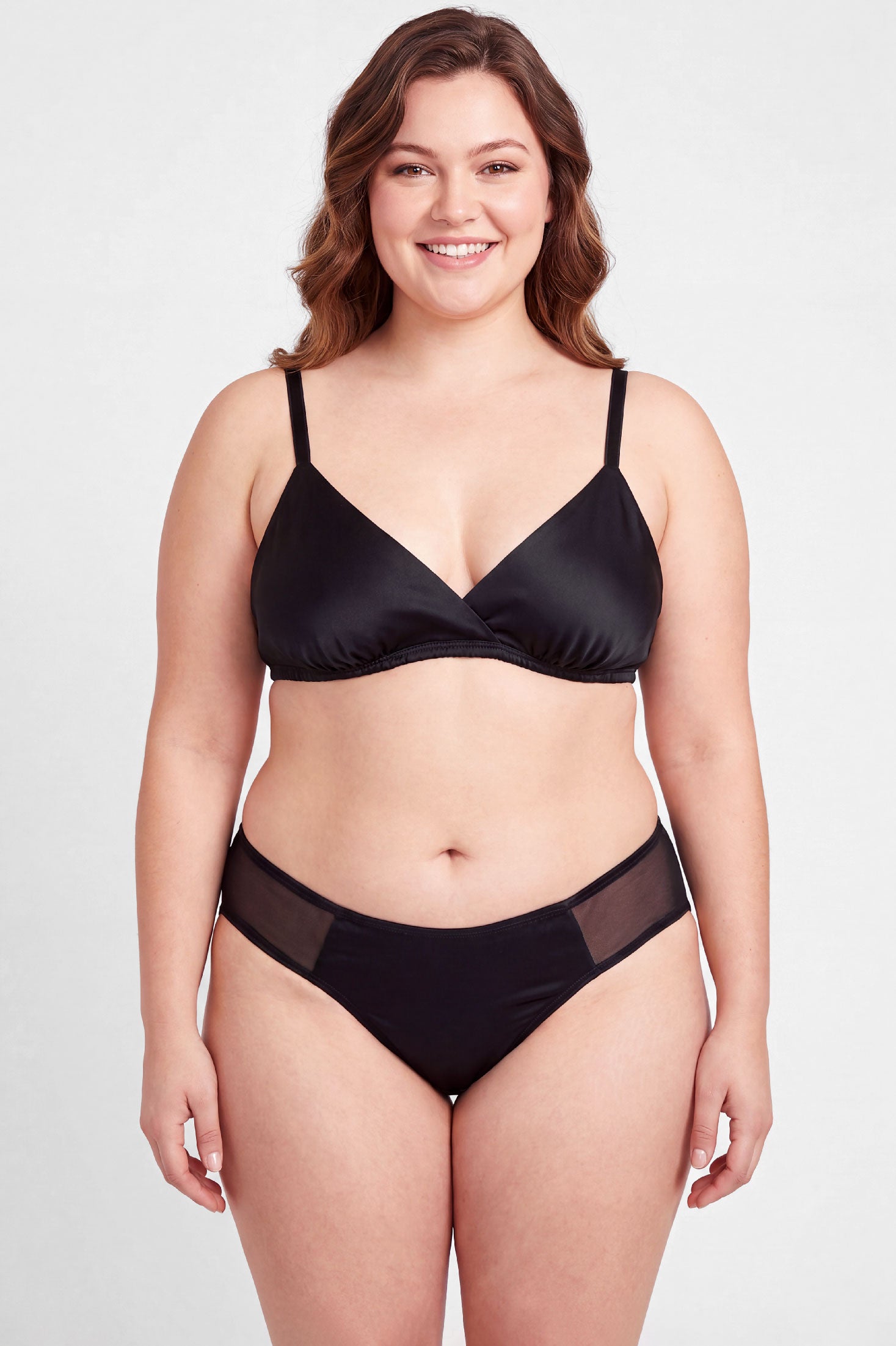 Silk lingerie set including a wireless bralet and black satin panties