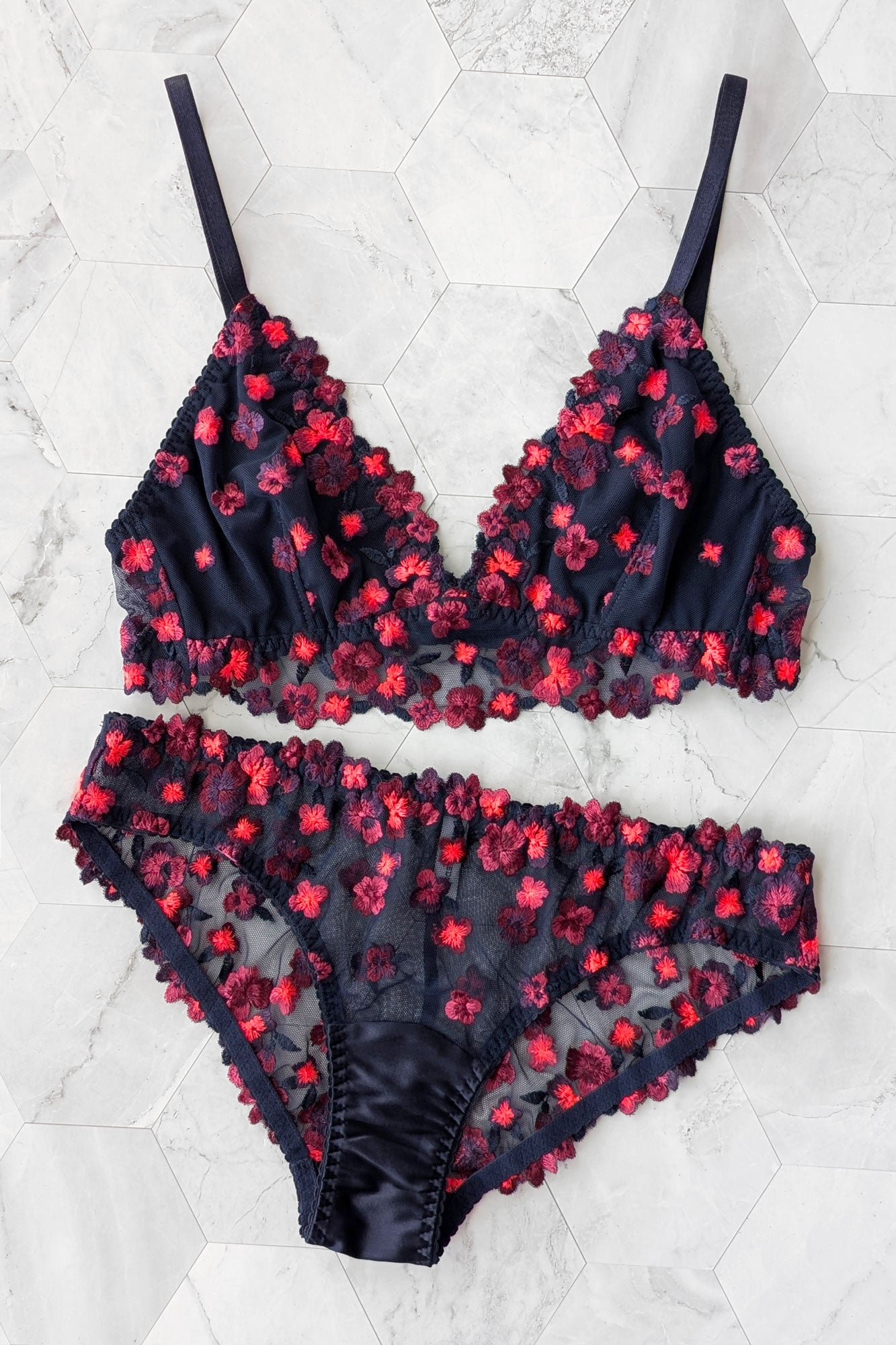 Whimsical lingerie set with flower child 1970s style embroidered daisies in neon colors with silk trimmings